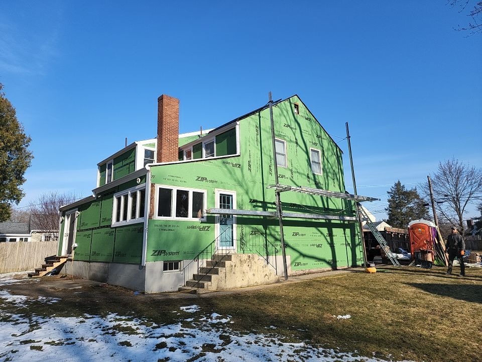 James Hardie siding, new metal roof and couple windows being installed. by UBrothers Construction