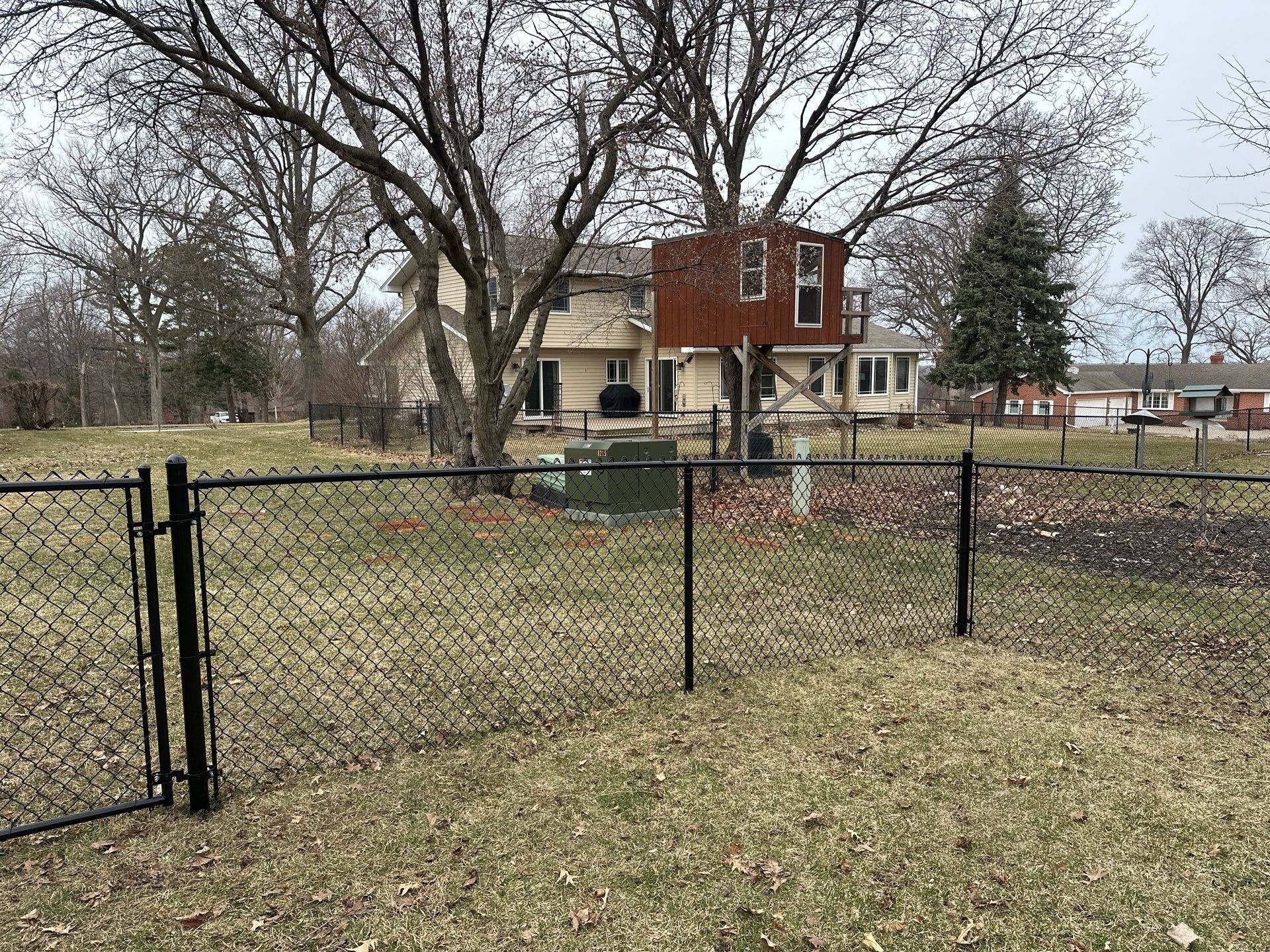Black Vinyl Chain Link Fence Installation in Cedar Falls by Perfect Picket Fence and Stain