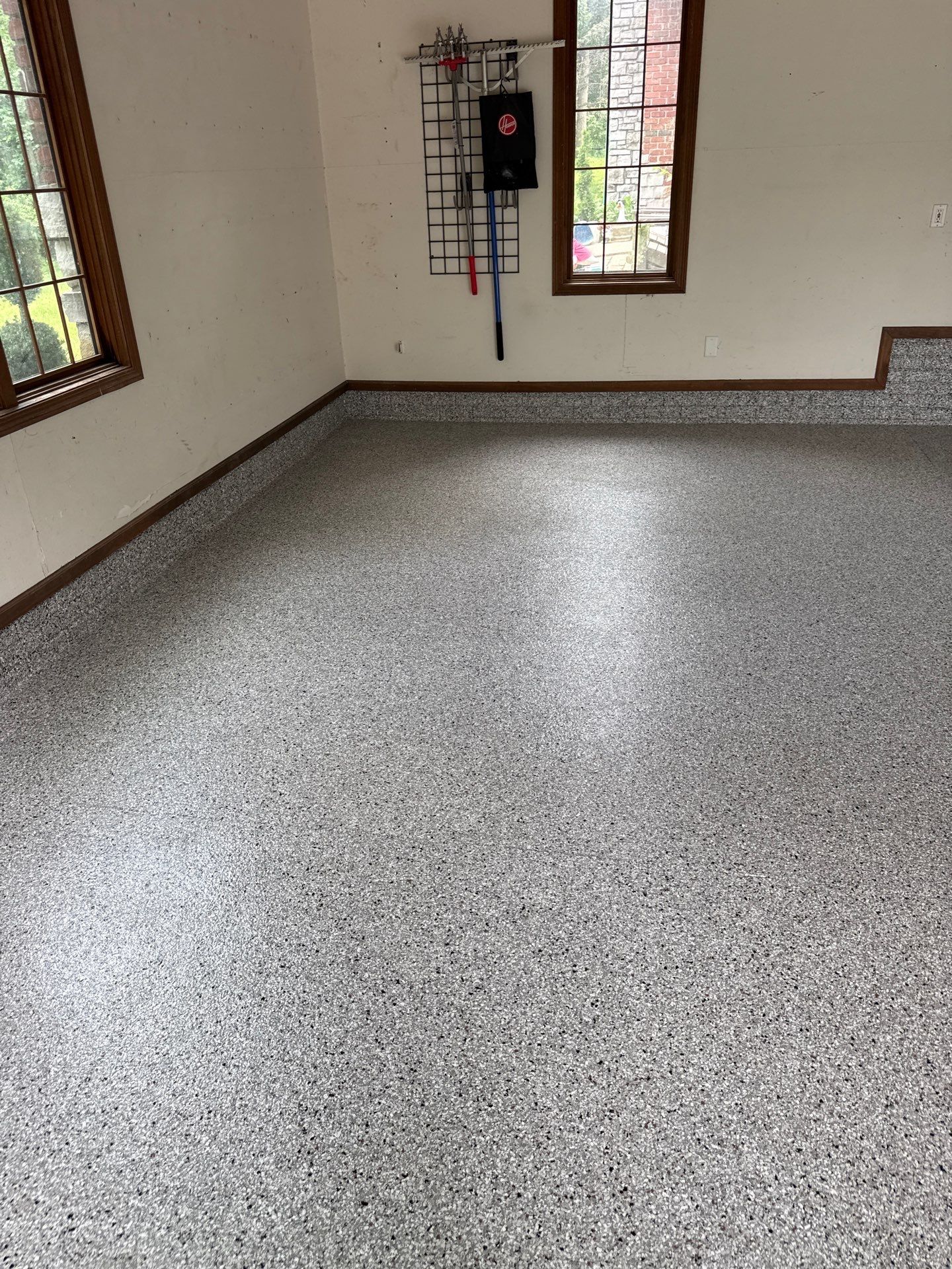 Coyote Flake Epoxy Garage Floor Coating in Earlham by Revival Concrete Coatings