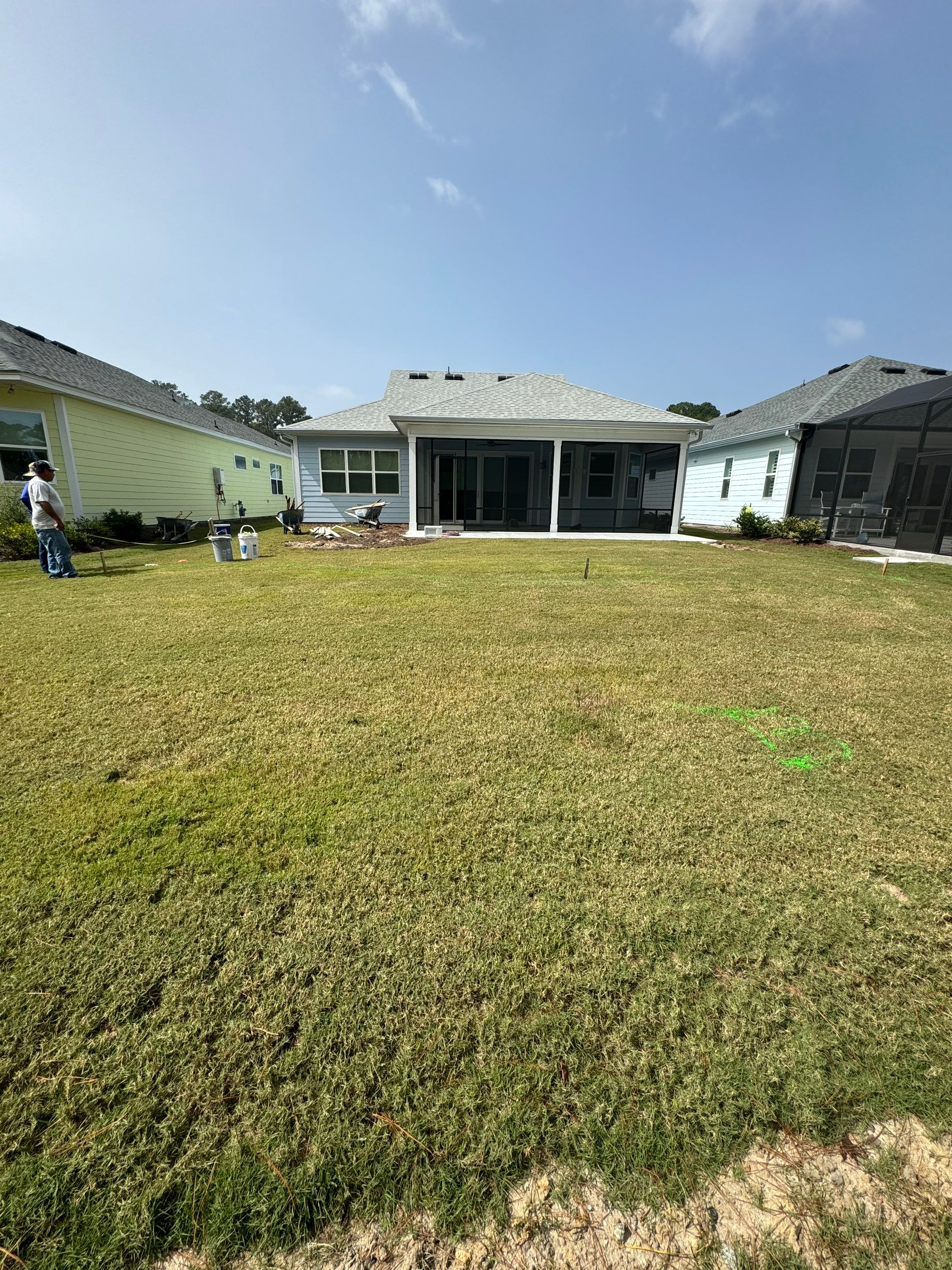 Hardeeville Screened-In Concrete Patio and Integrated Artificial Turf by Lowcountry Scapes, LLC