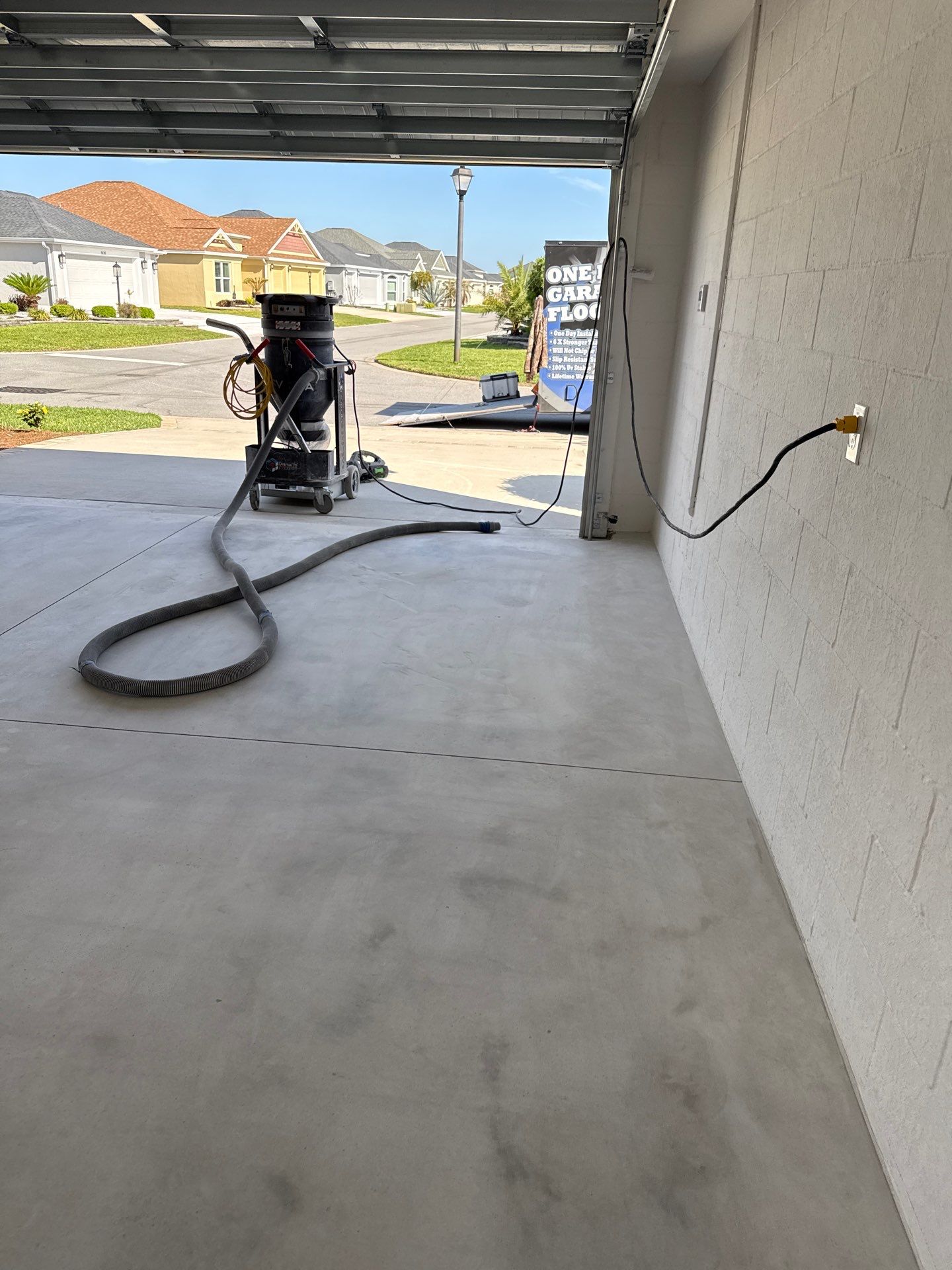 Garage and Lanai With Exterior Pad in Sandstone  by Innovative Concrete Coatings 