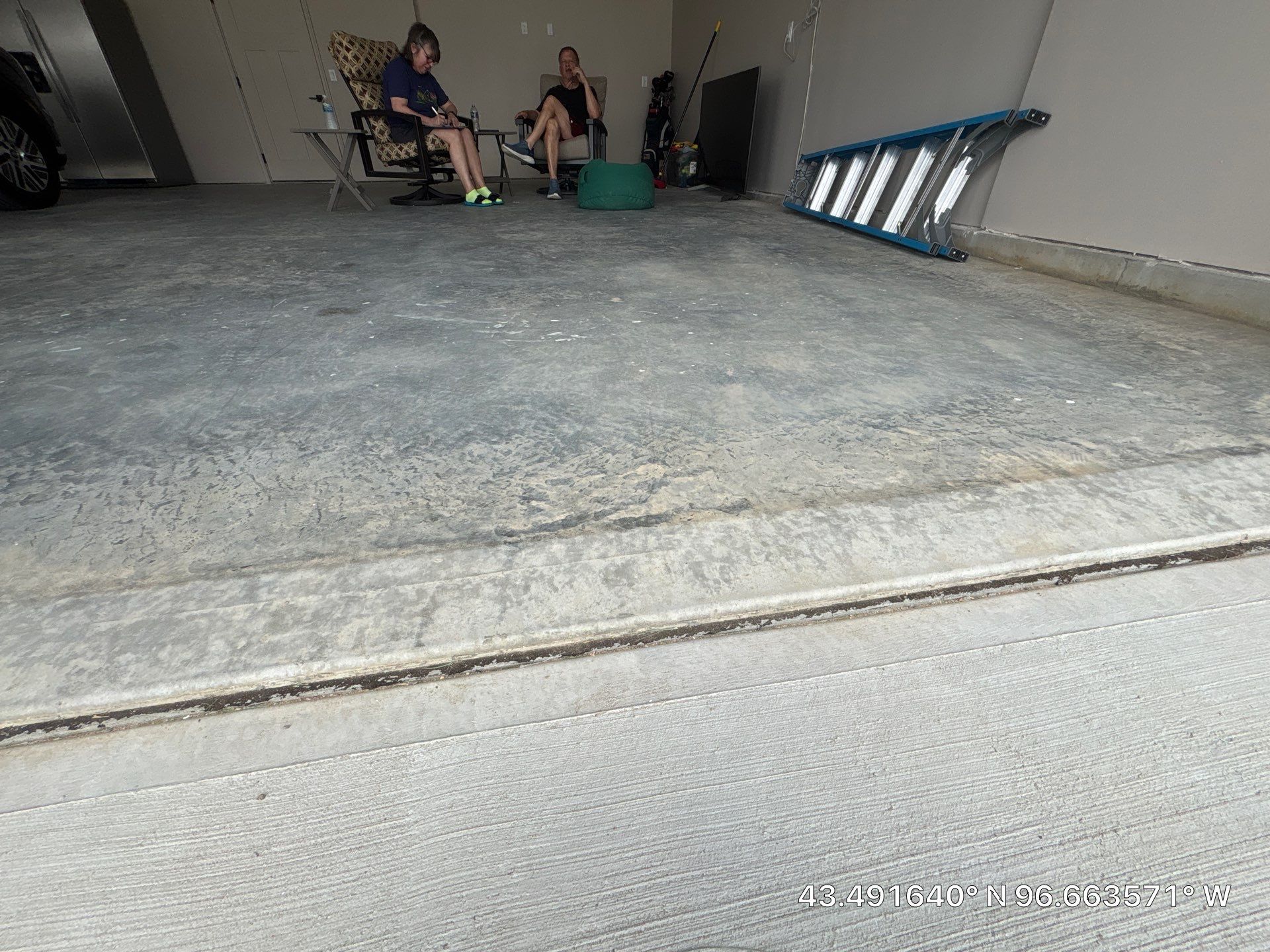 Full Speckled Concrete Coating for Sioux Falls Garage by Select Painting, Coatings & Garage Cabinets