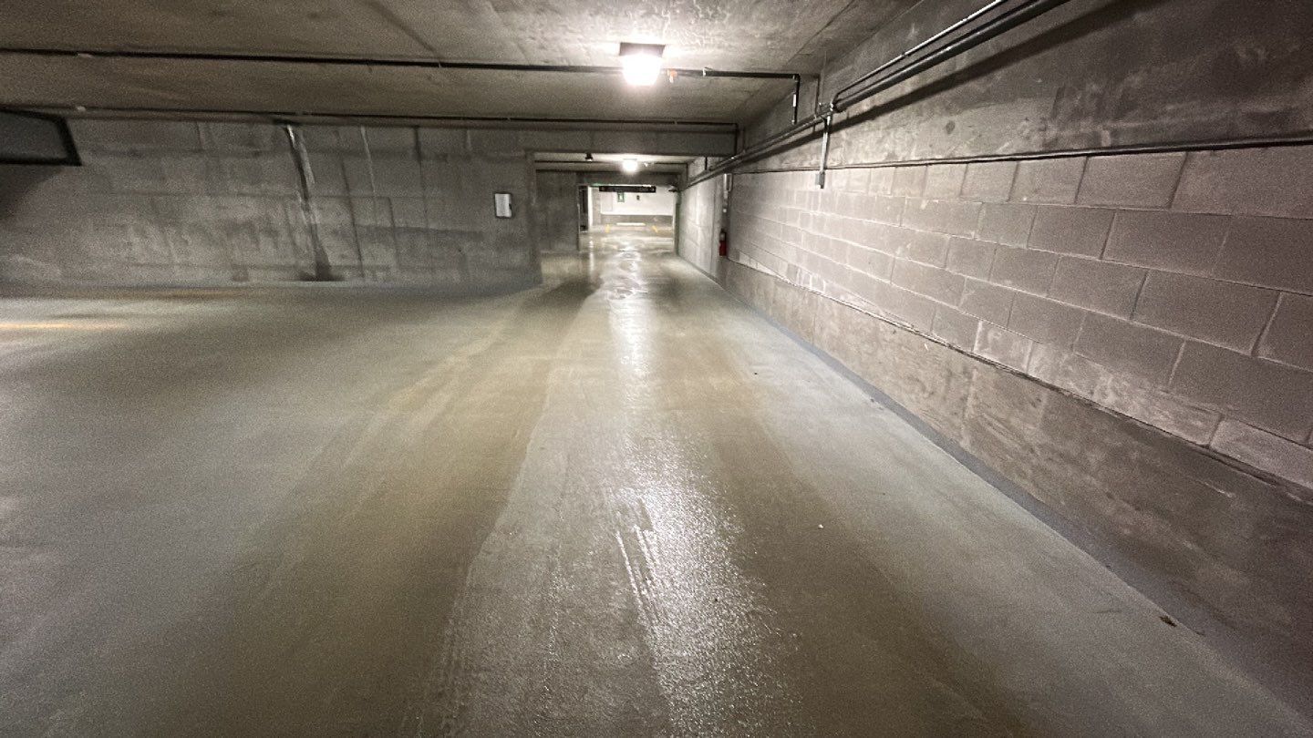 Parking garage using Hot water by Northern Power Washing LLC.