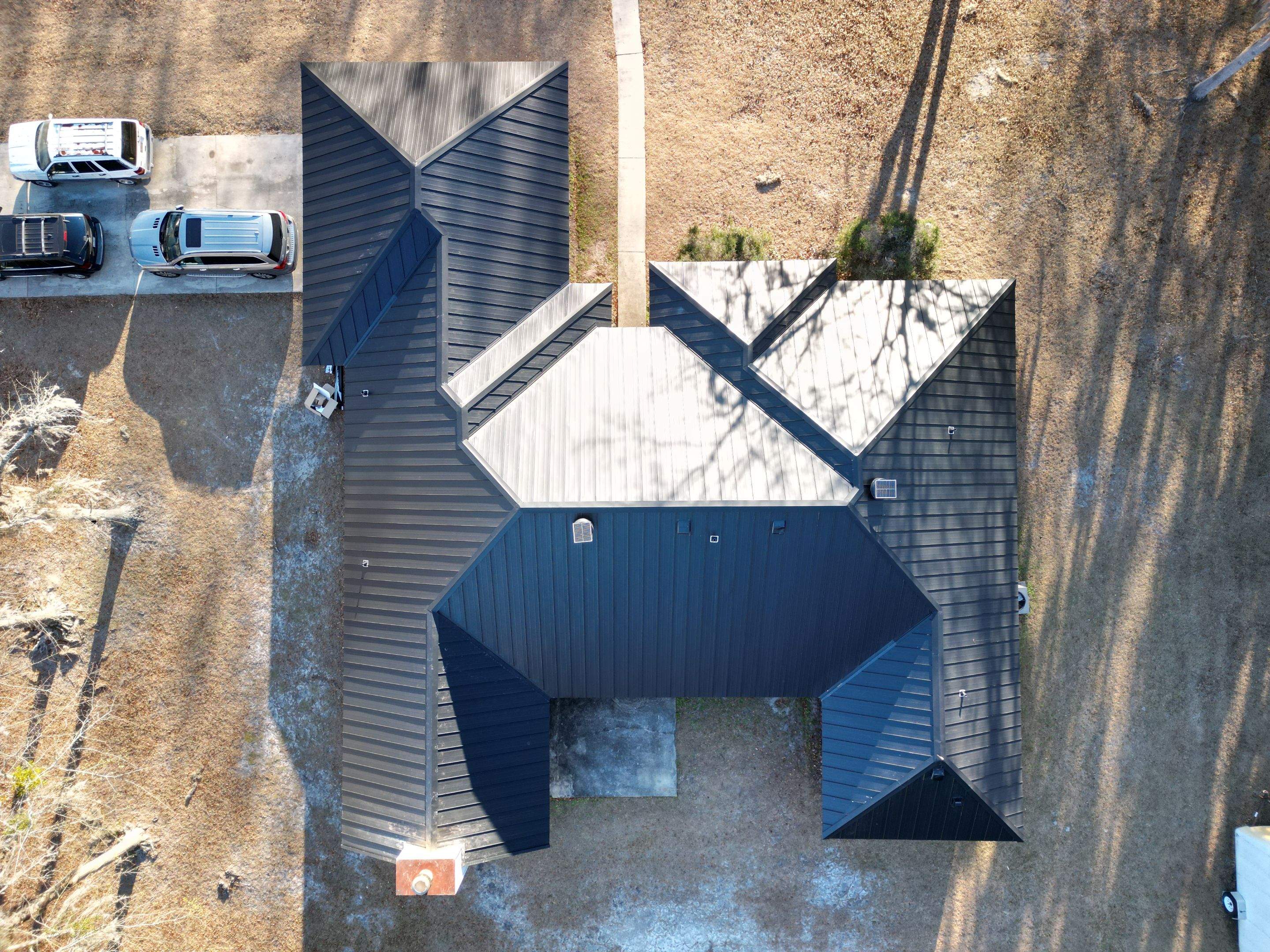 Residential Roofing Installation using Benton 26Ga 1inc Snapcock Metal Roof KYNAR Matte Black by Talya Roofing