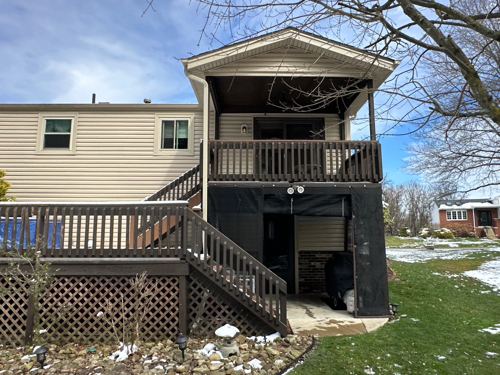 Elevated Composite Deck Installation with Covered Porch in South Park Township by Cousins Roofing Siding & Decks
