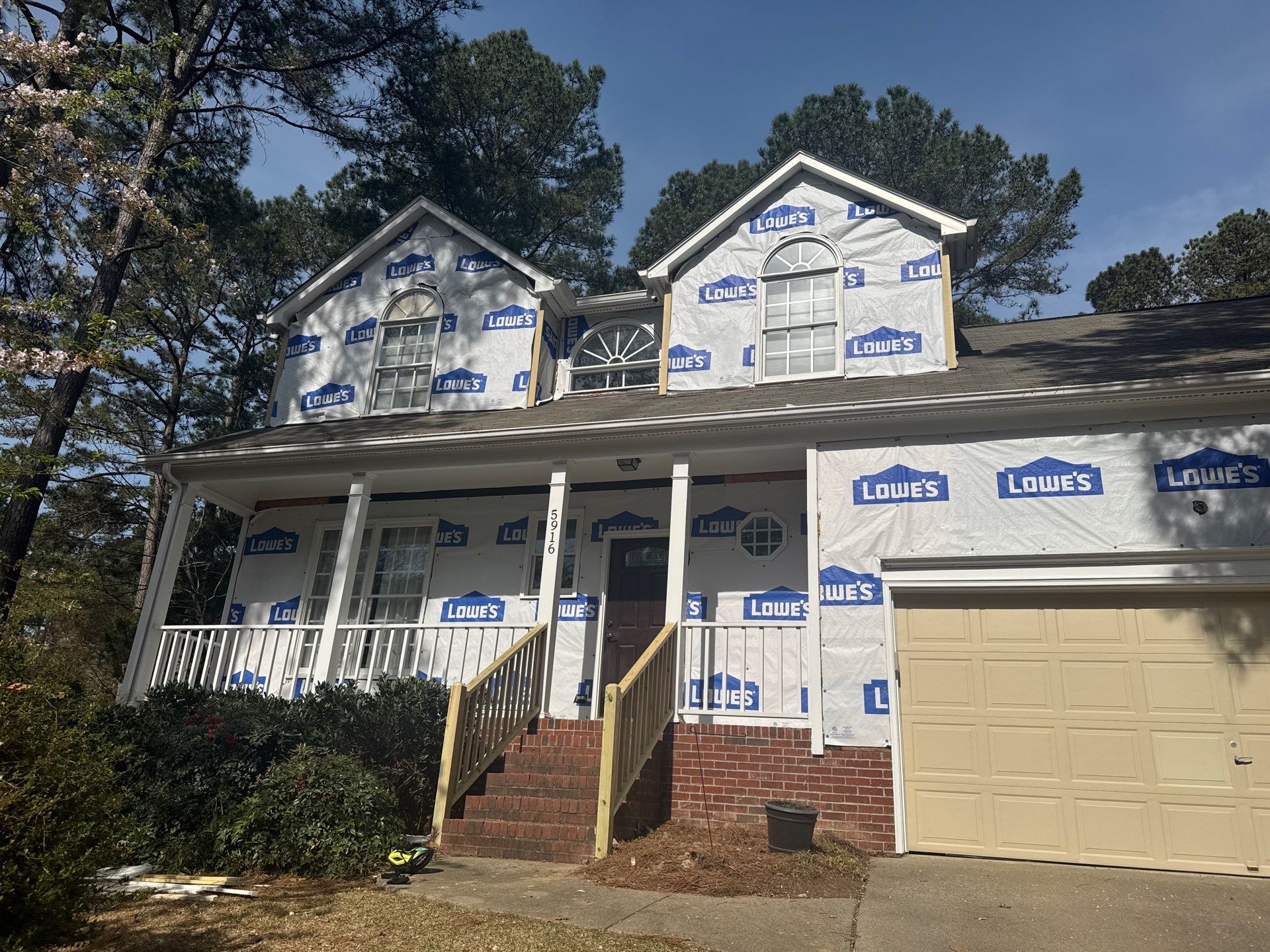 Exterior paint and siding replacement by GonzalezPainters & Contractors Inc 