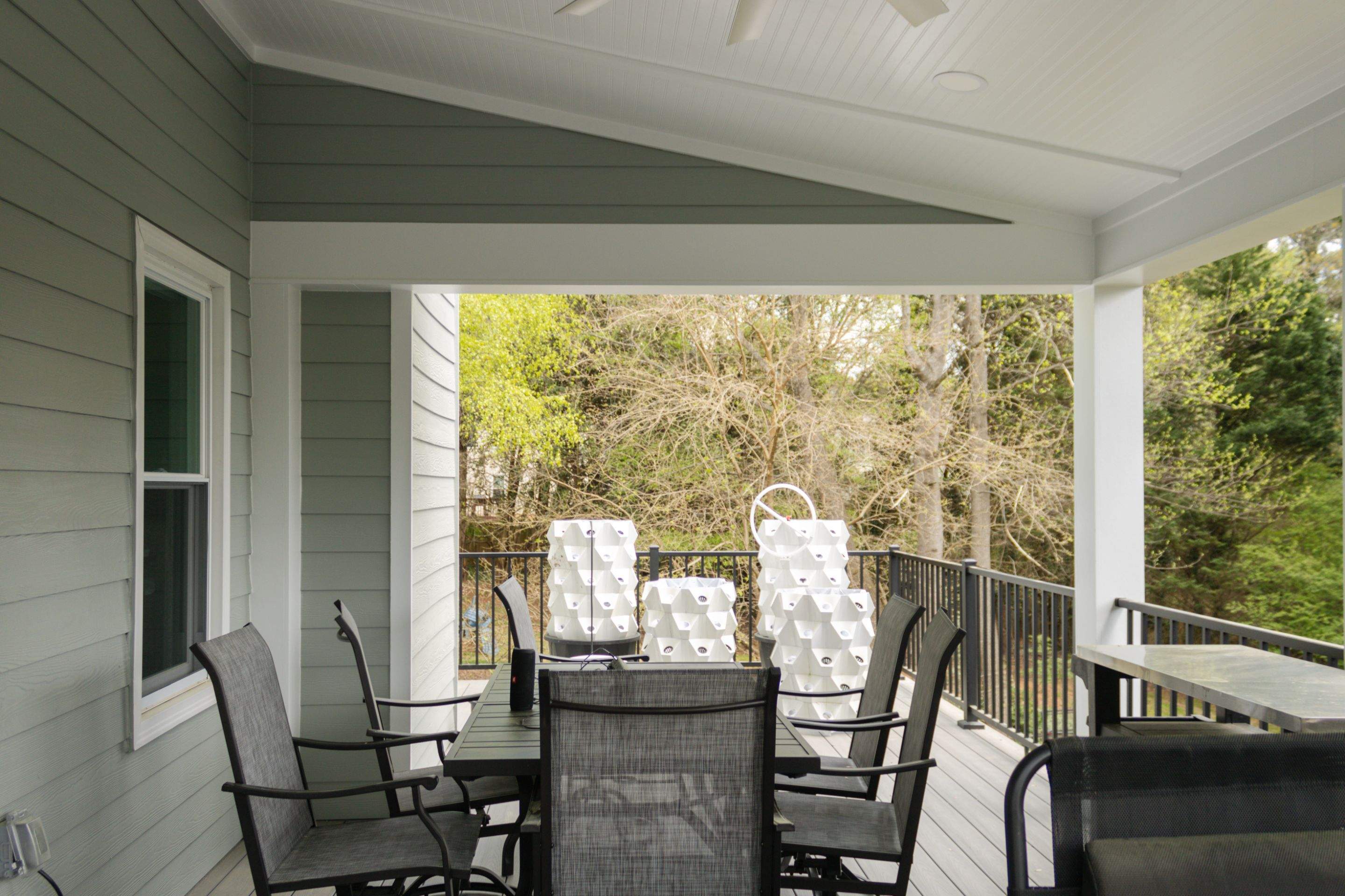 Covered Porch and Deck Build using Deckorators Venture Series Decking and Trex Select Aluminum Railing by Nelson Exteriors