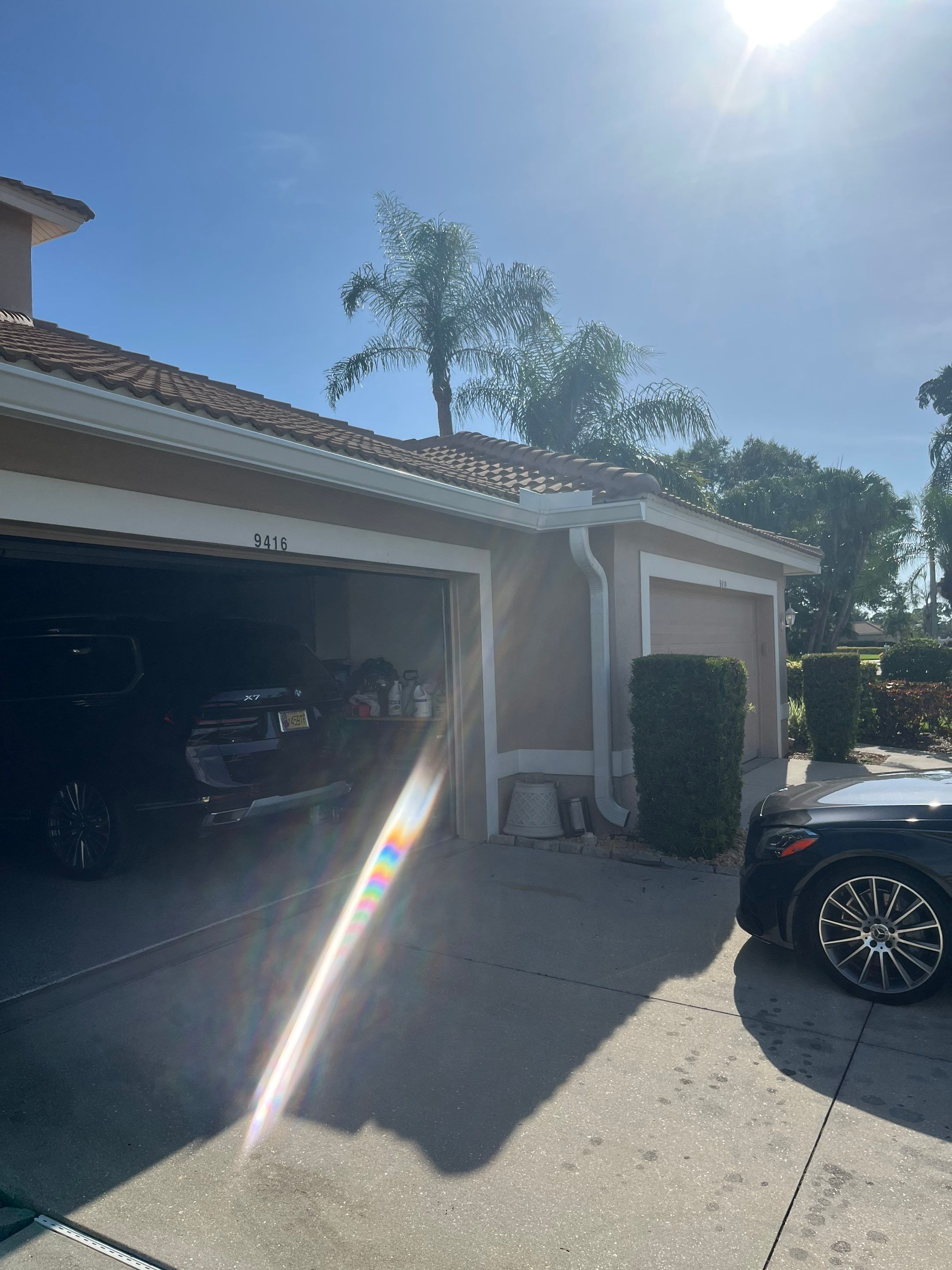 Replace White Seamless Gutters Installation in Sarasota FL by Gutter Professors