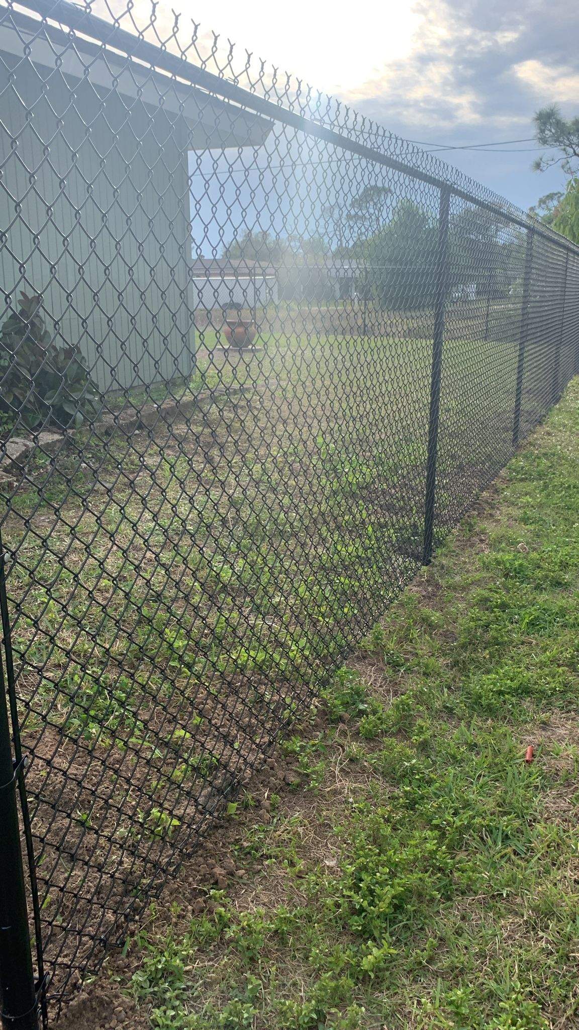Black Vinyl-Coated Chain-Link Fence Installation in Port Charlotte by True Fence LLC