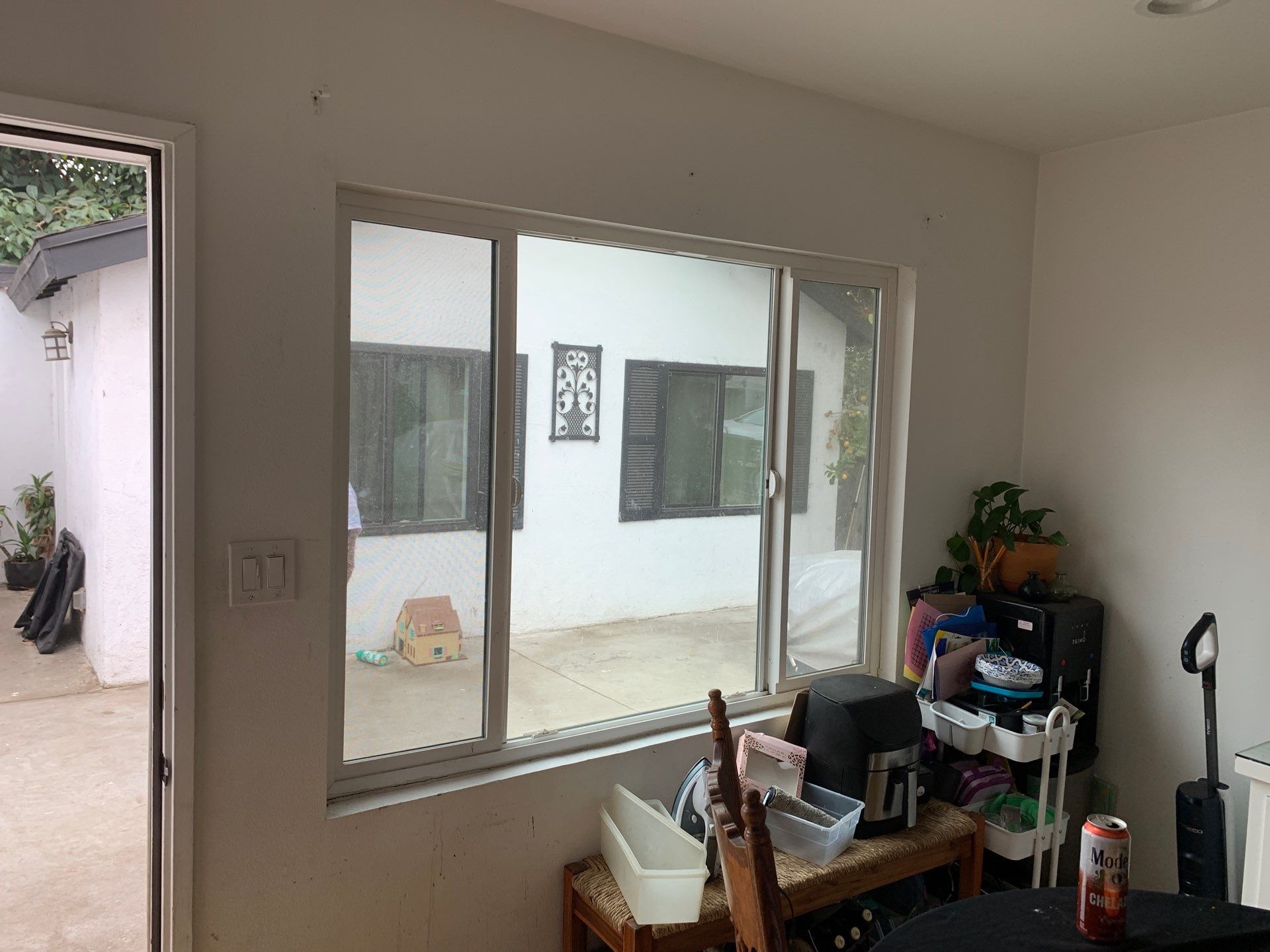Window Installation using black Vinyl Windows by American Window Company
