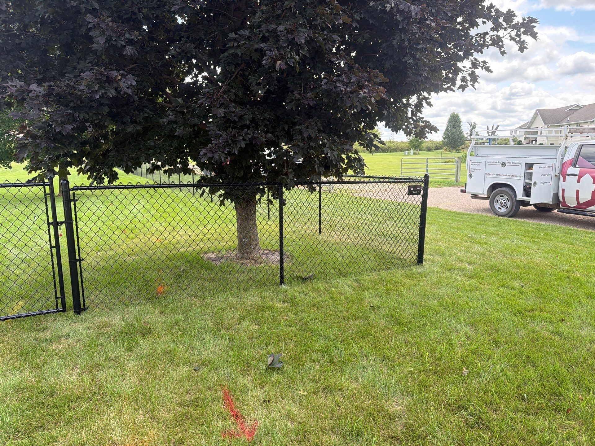 Black Vinyl-Coated Chain Link Fence Installation in Fairbank by Perfect Picket Fence and Stain