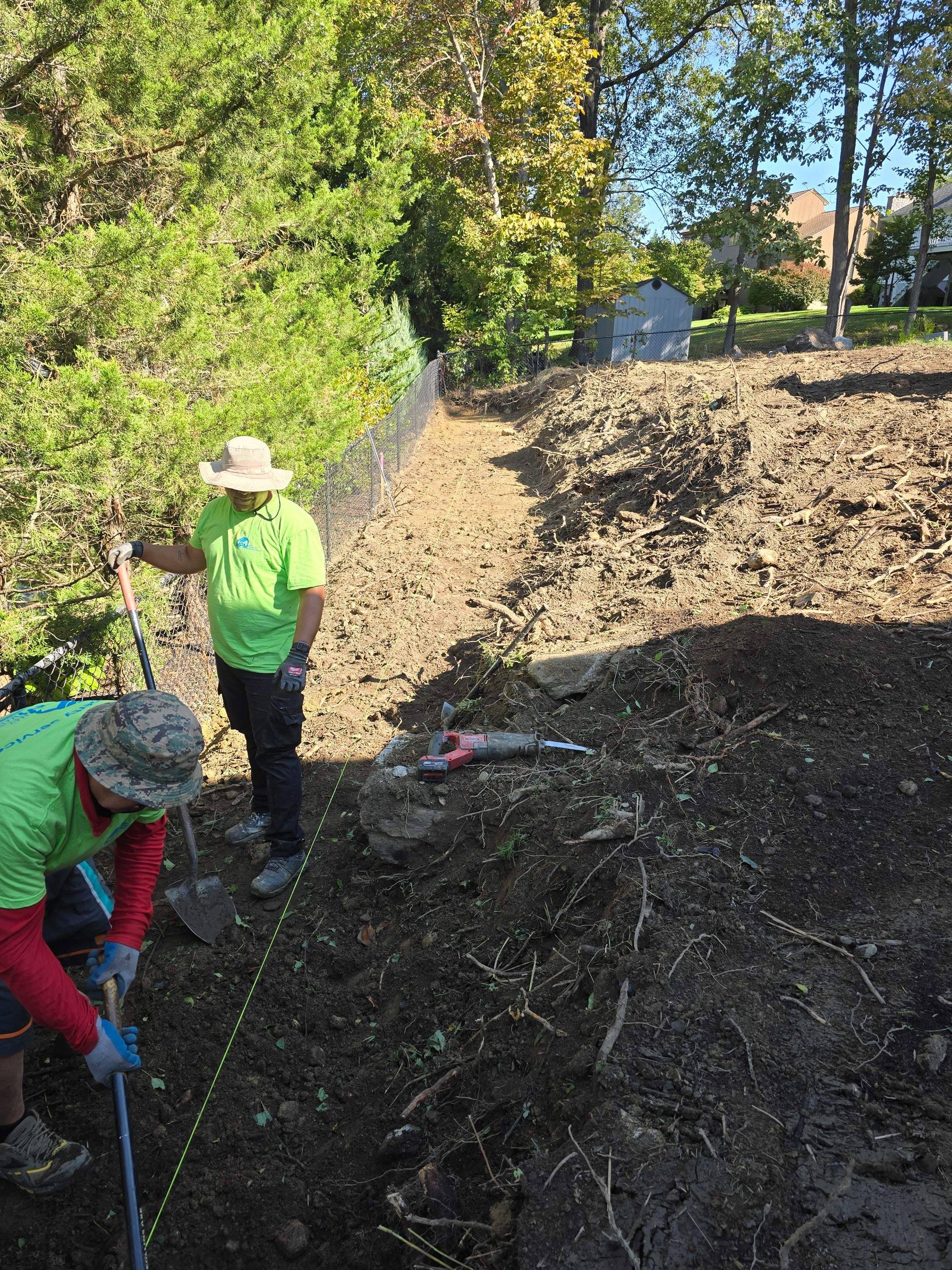 Retaining Wall to Level Backyard  by May Property Management 