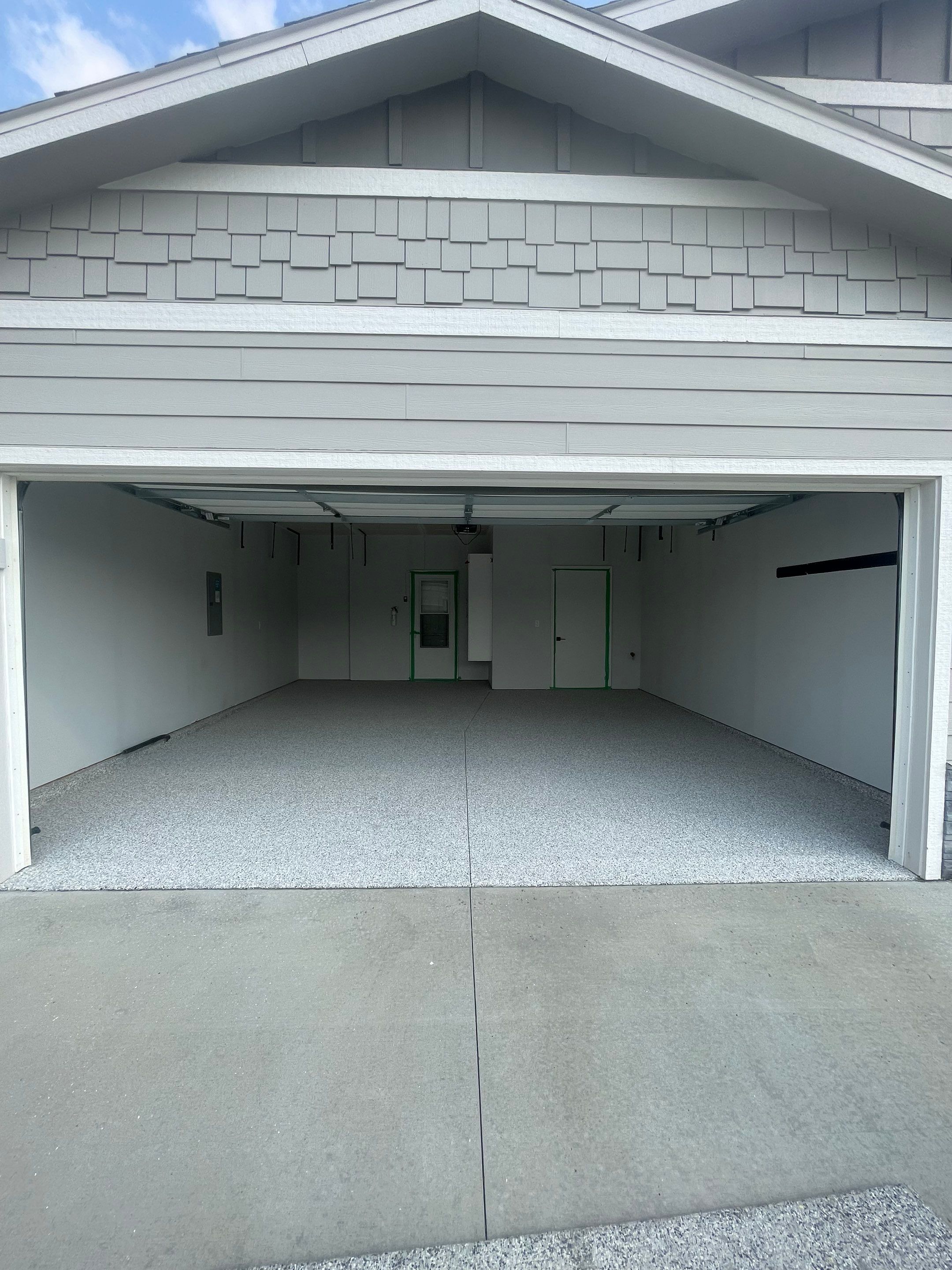 Custom Coyote Flake Garage Floor Coating in Sioux Falls by Select Painting, Coatings & Garage Cabinets