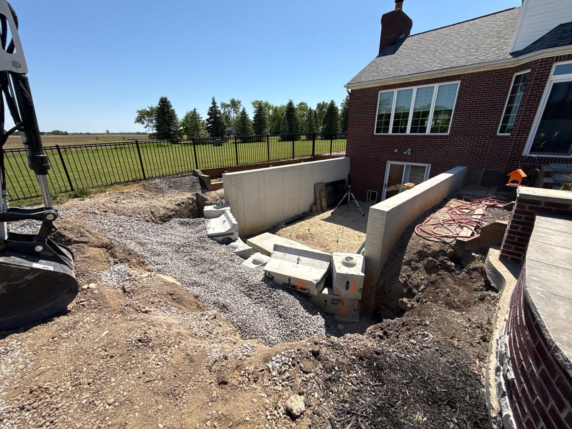 Basement Walkout Construction with Tiered Retaining Walls in Berkey by Farrell's Lawn & Garden Center LLC