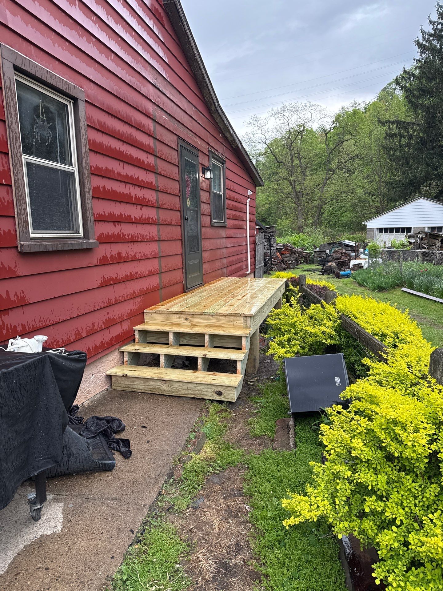 Roof sunspace deck  by Cousins Roofing Siding & Decks