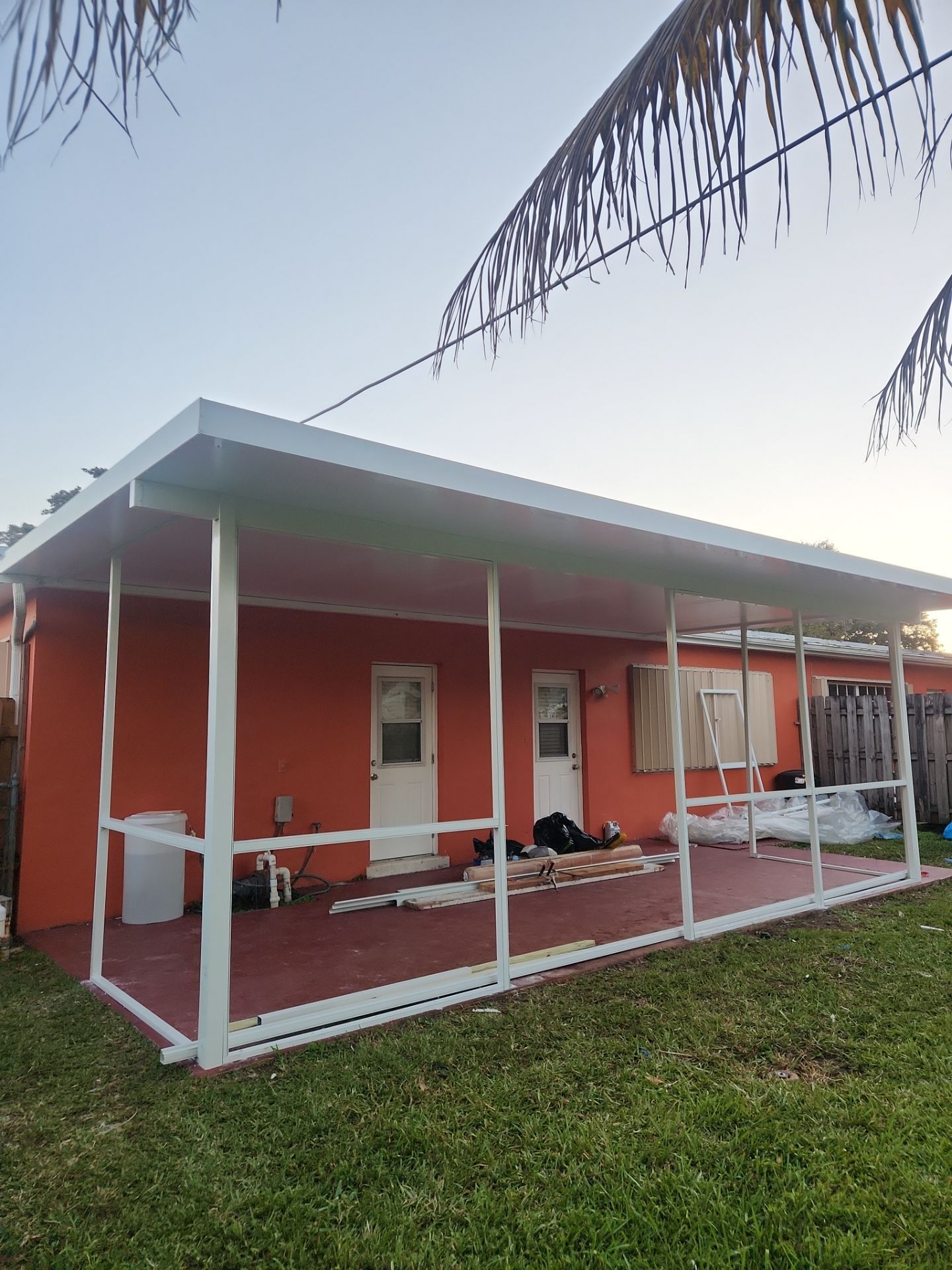 Insulated Screen Enclosure and Wood Tile Deck Installation in Plantation by Aastro Roofing