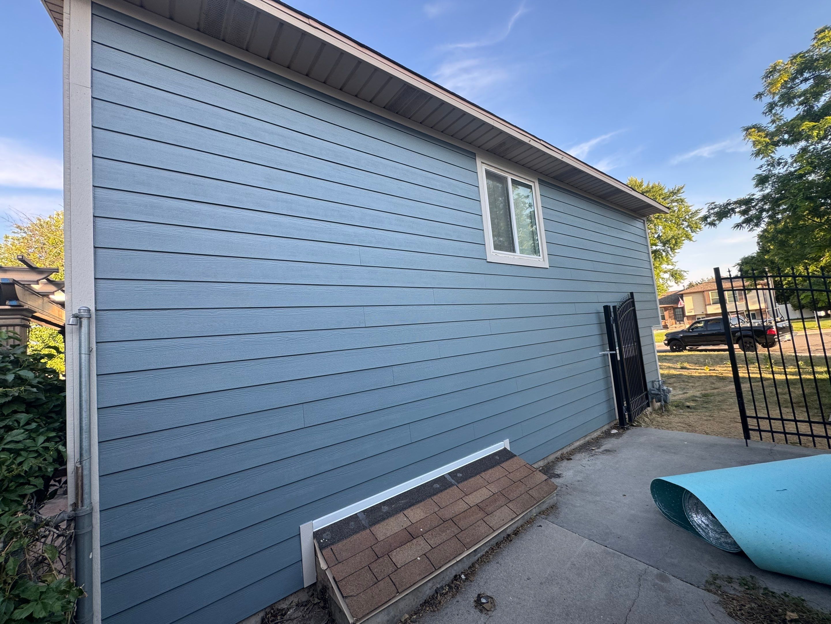 West Jordan | Hardie Lap Siding w/ Brick Accent | Boothbay Blue & Cobble Stone by Ideal Siding Utah