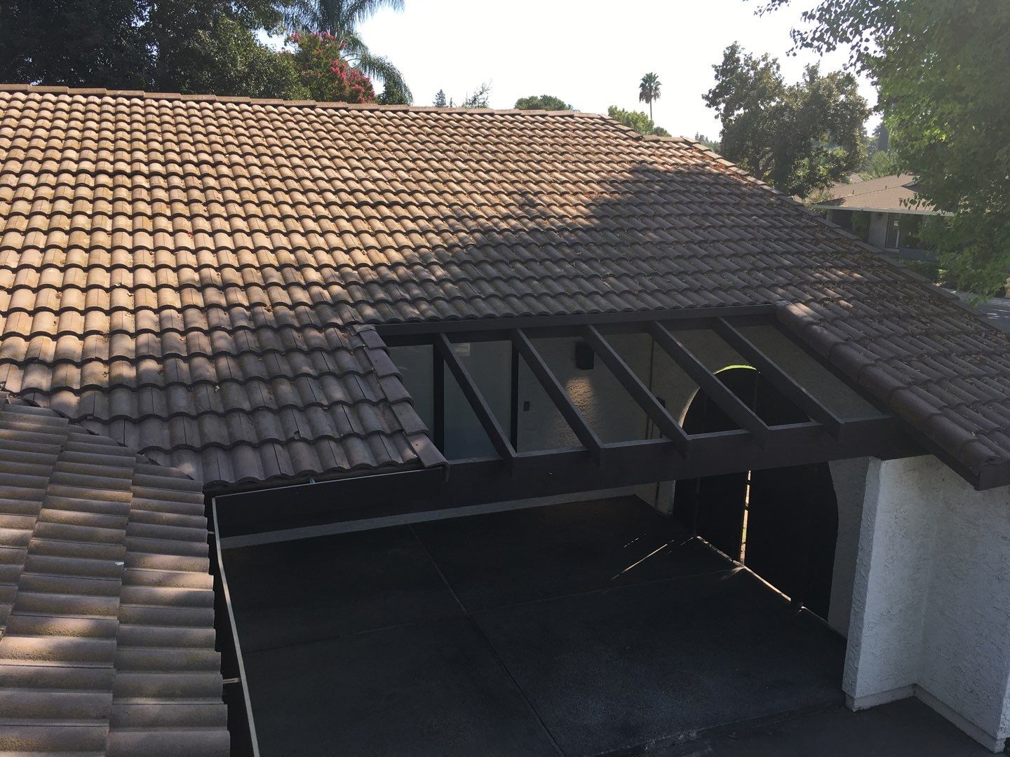 Tile roof remodel/ install OSB sheathing under tile and replace using OSB board with new underlayment, tile, and battens by Straight Edge Roofing Inc