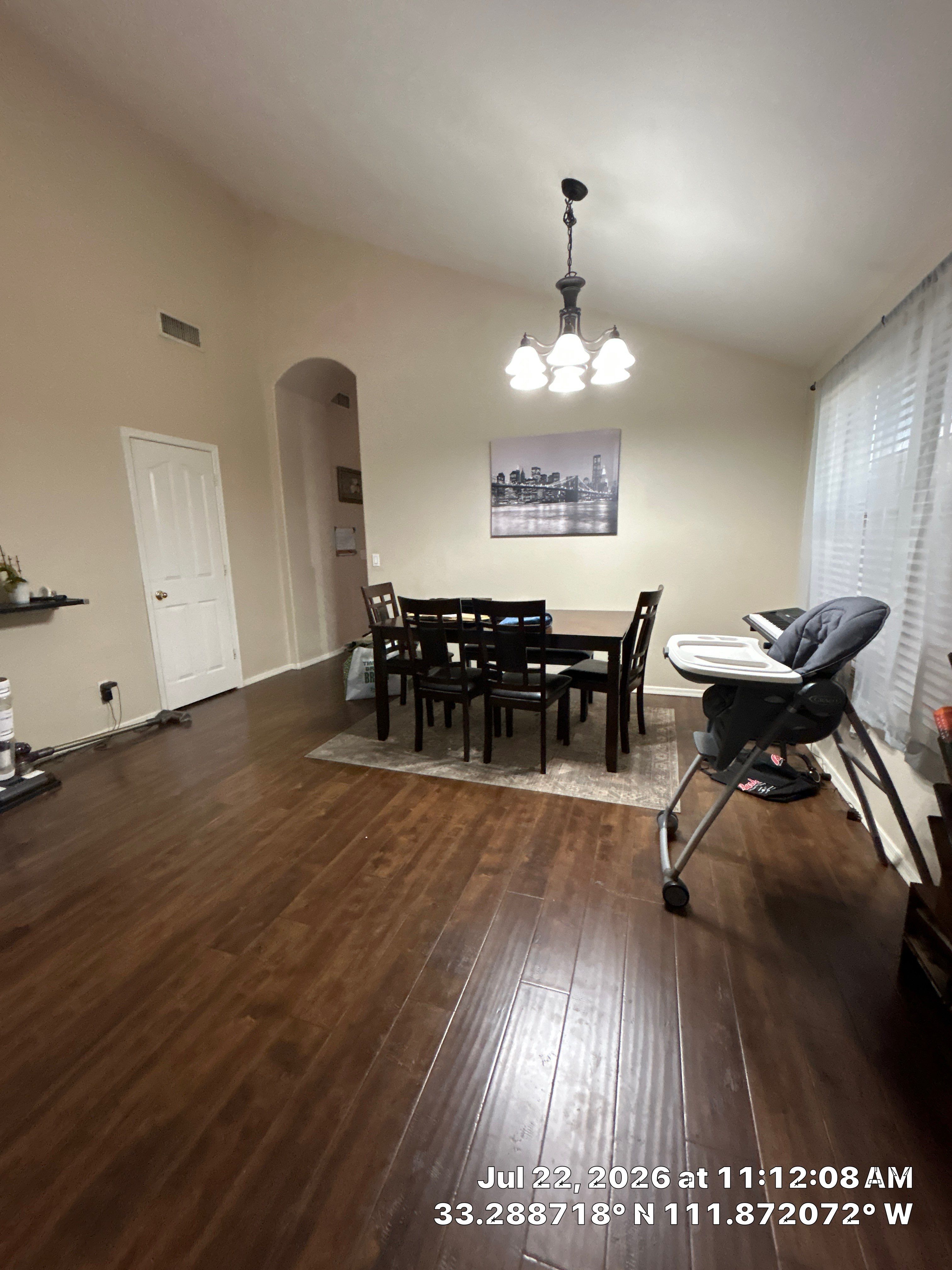 Chandler Dining Room Floor Remodel with Dark Wood-Look Laminate by CompanyCam Sales Demo