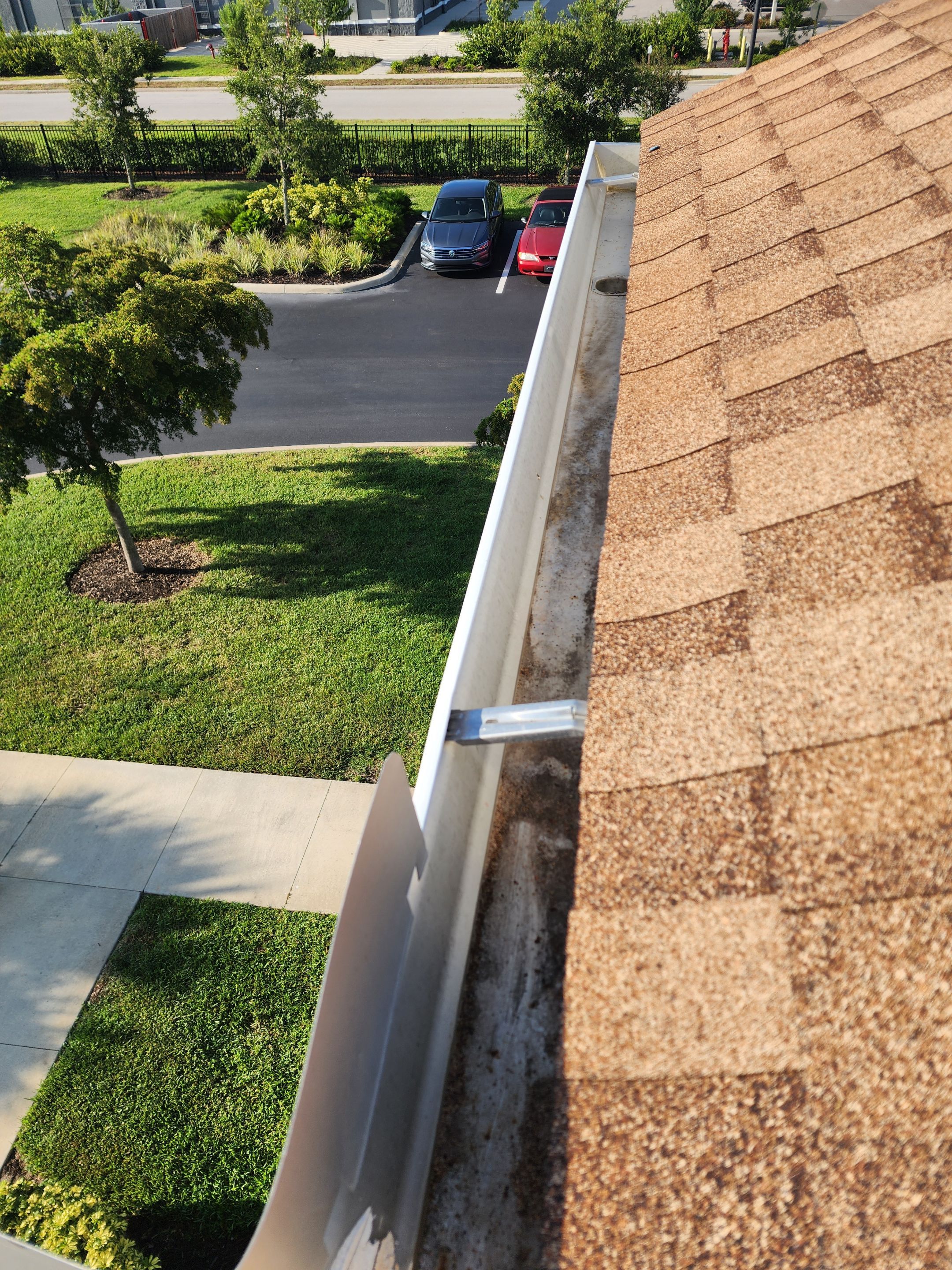 HOA gutter cleaning in Port Charlotte, FL, after  photo showing full gutters.