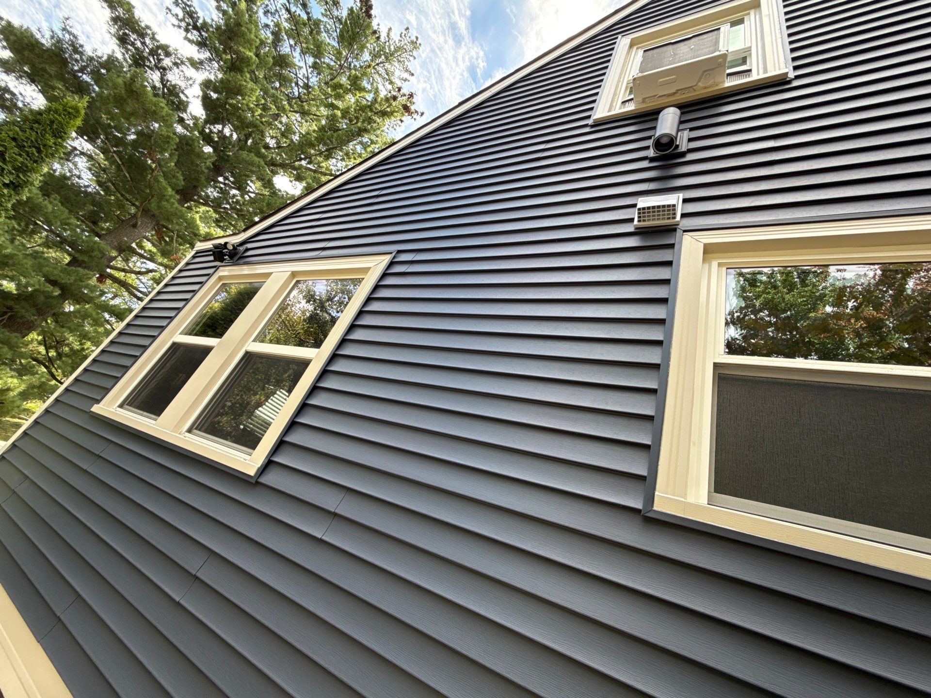 Kansas City Indigo Insulated Craneboard Siding and Window Replacement Project in Kansas City by EEC Windows, Siding & Roofing
