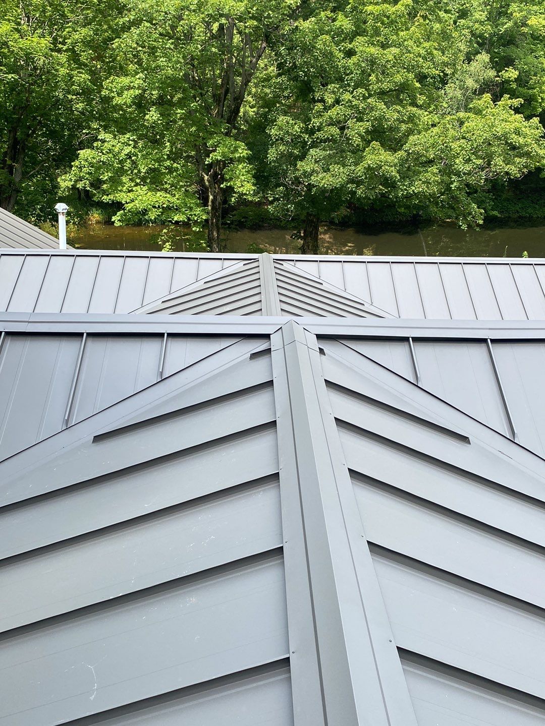 Residential Roofing Installation using 24 Ga Standing Seam Meta by Jay Carter Roofing & Sheet Metal