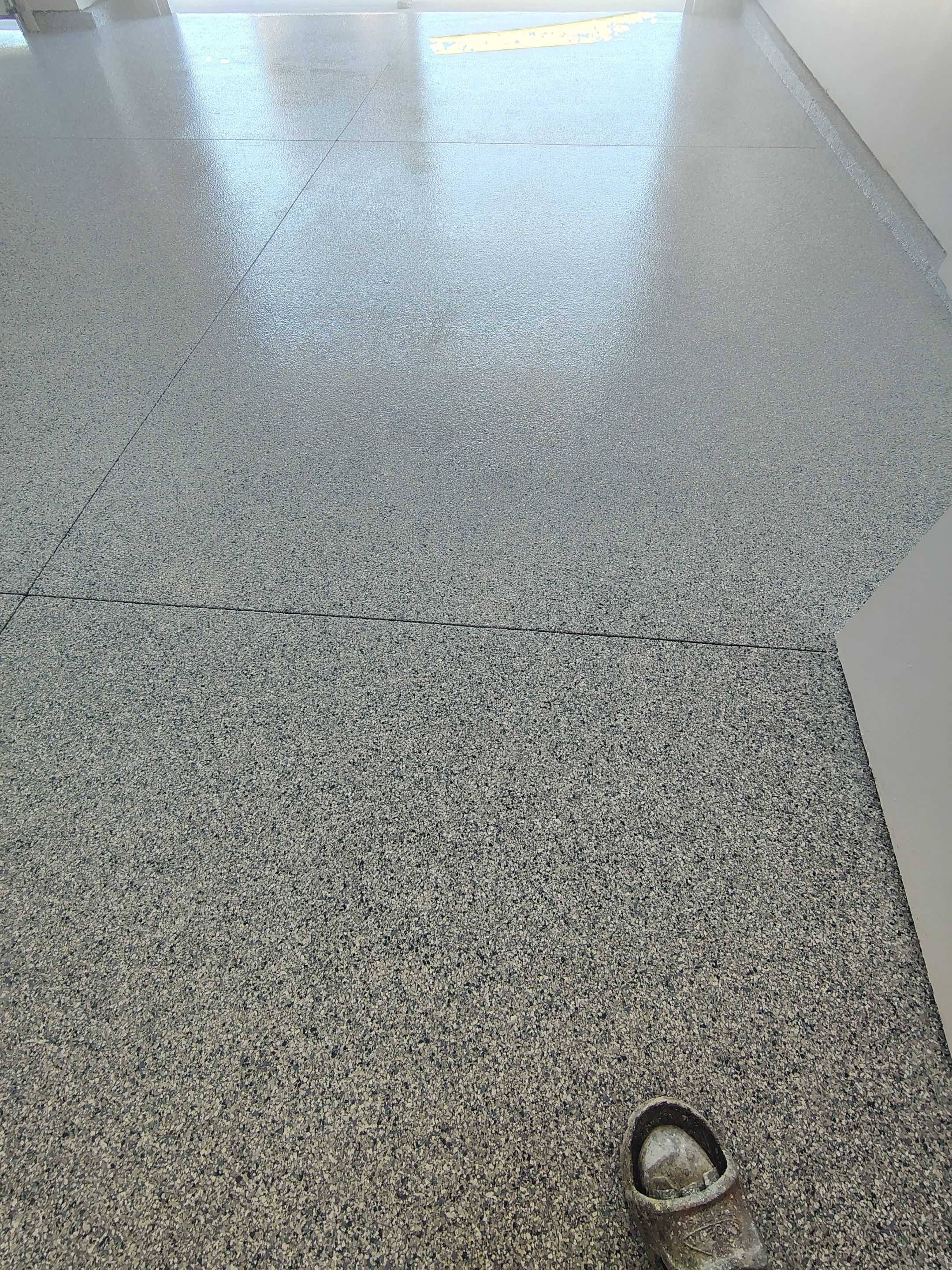 Full Speckled Concrete Coating for Sioux Falls Garage by Select Painting, Coatings & Garage Cabinets
