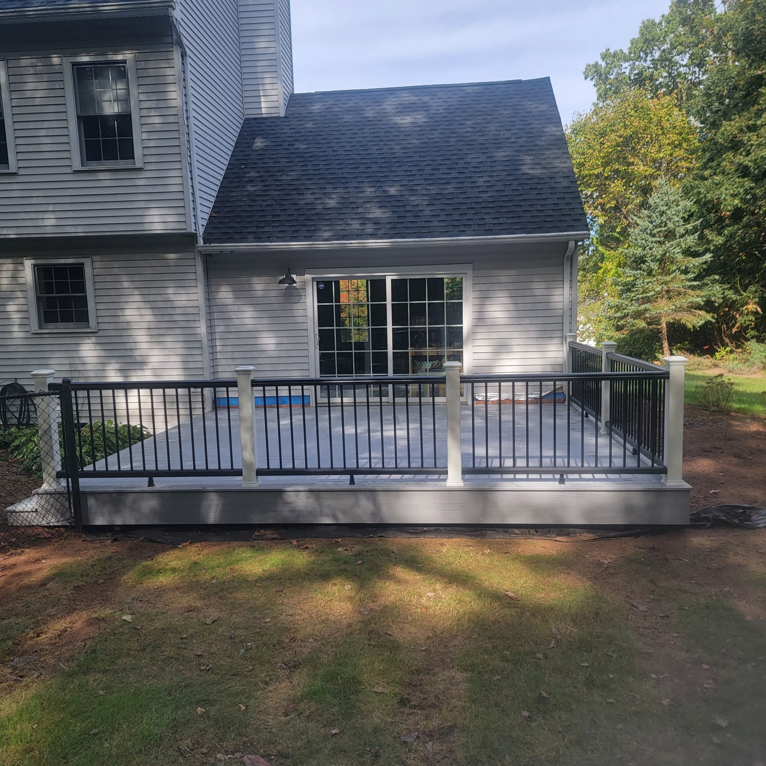 Deck replacement using Trex lineage Rainier and Black and White Transcend railings by DiGiorgi Roofing and Siding Inc