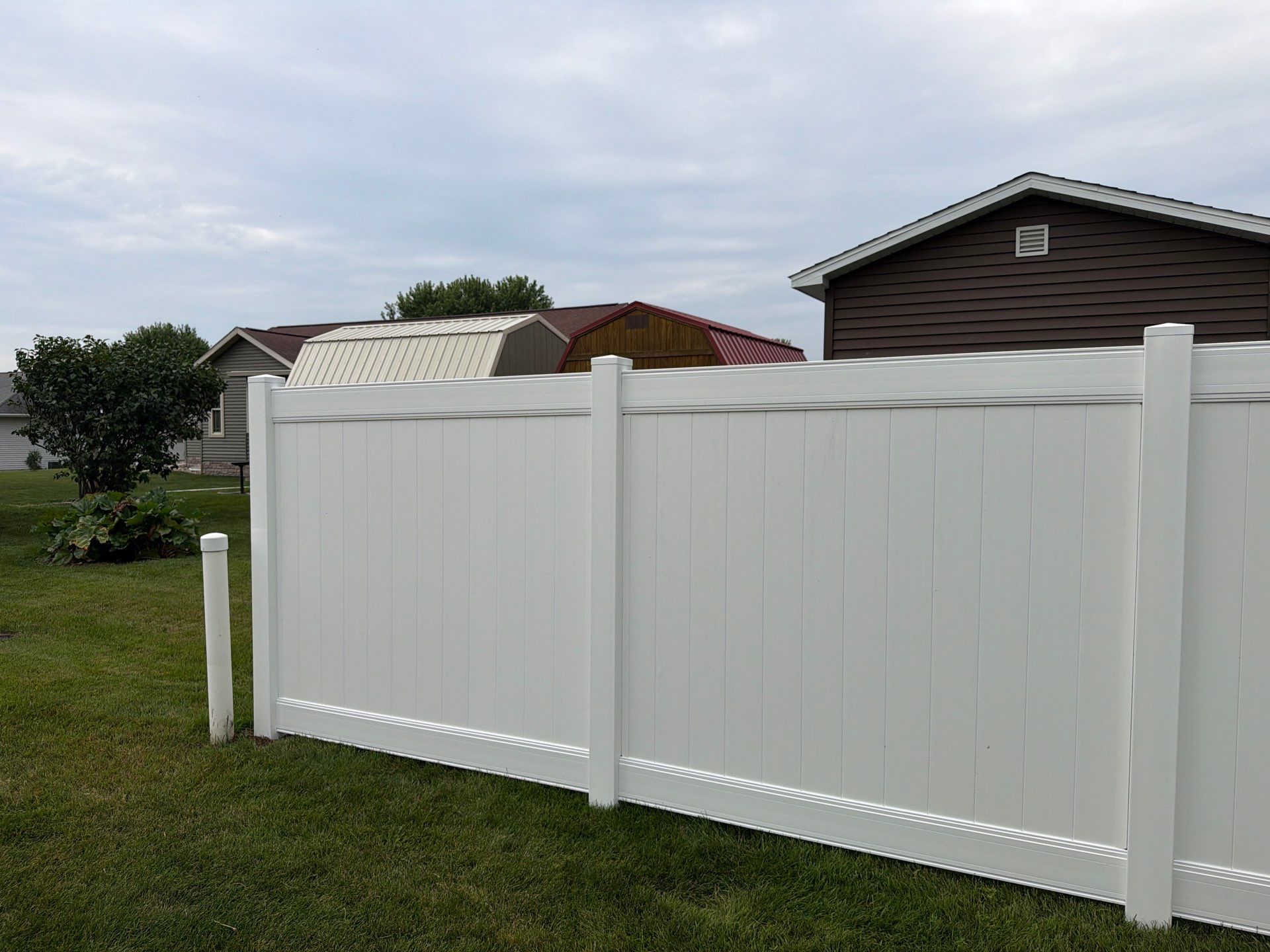 White Vinyl Privacy Fence and Double Gate Installation in Jesup by Perfect Picket Fence and Stain