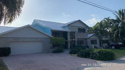 Residential Roofing Installation using 1" Nail strip metal roof