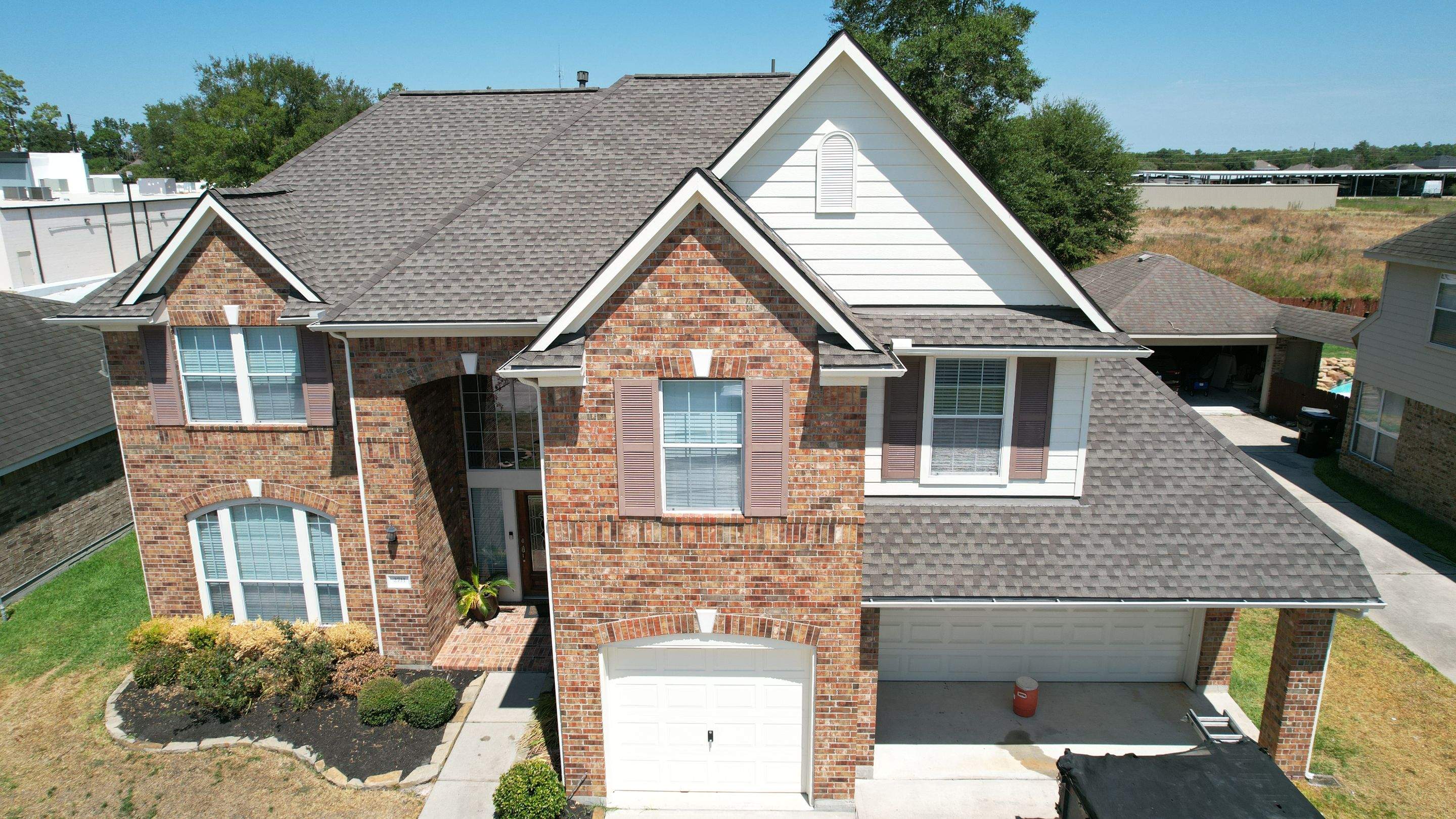 Brick Two-Story Roof Replacement, Tear-Off to Finish — Spring, TX by PL Roofing & SB Roofing, LLC.