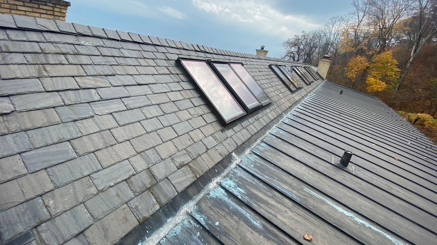 Slate Roof Replacement and Half Round Copper Gutter Installation by Custom Installations, Inc.