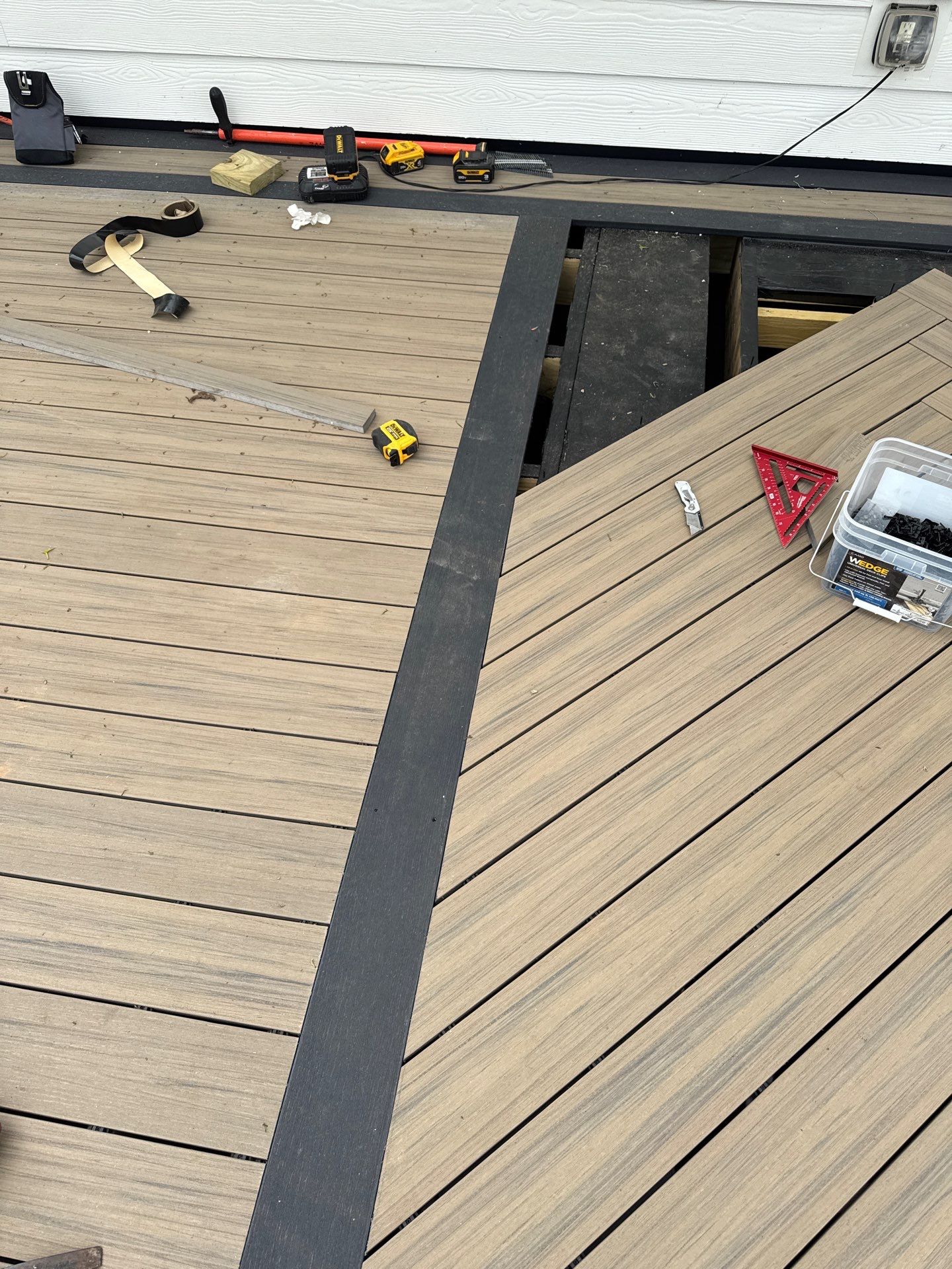 Deck Resurface with Glass Paneling and Deckorators Voyage Series Products by Nelson Exteriors 