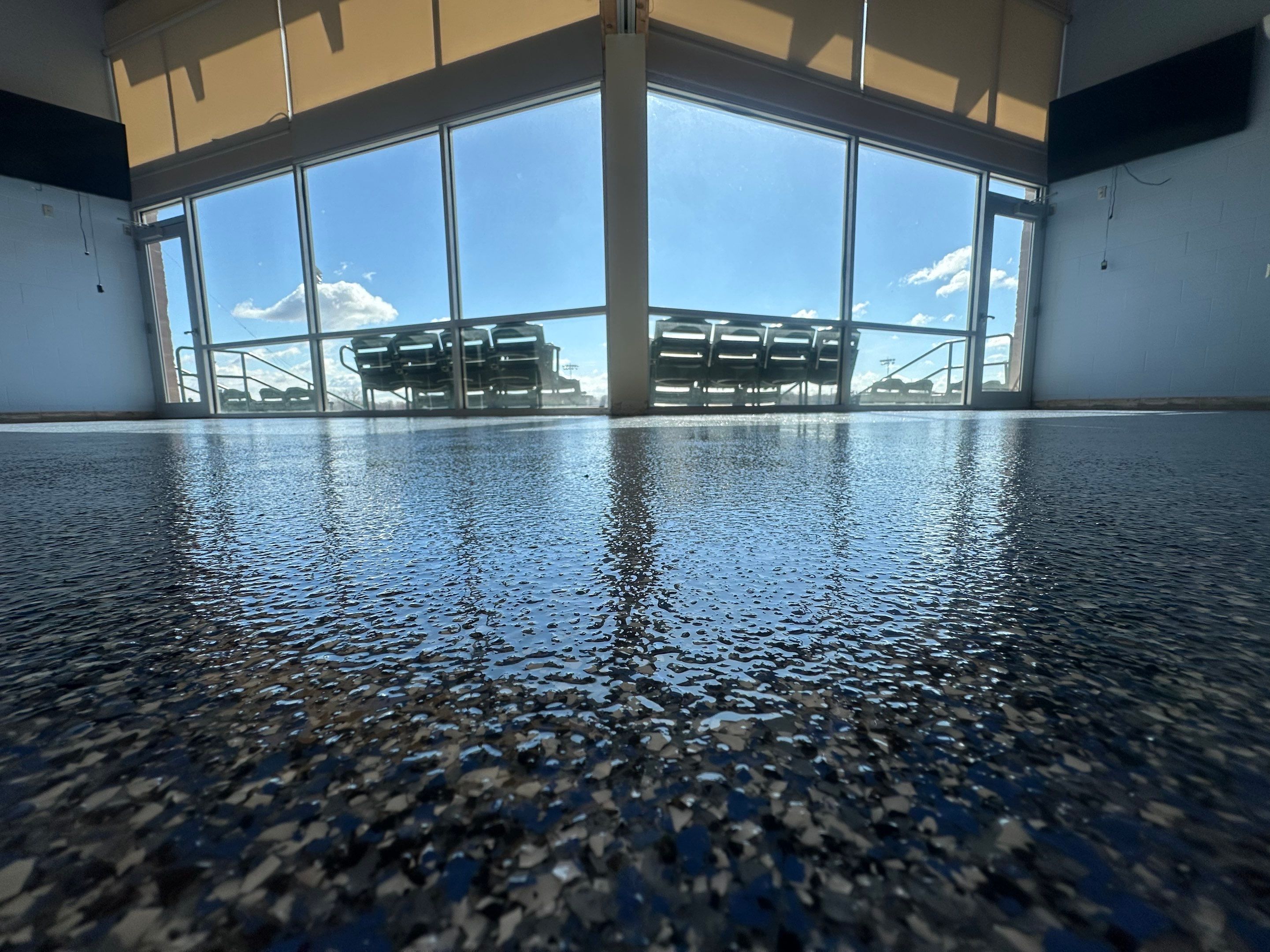 Commercial Epoxy Floor Coating for Stadium Viewing Suites in Sioux Falls by Select Painting, Coatings & Garage Cabinets