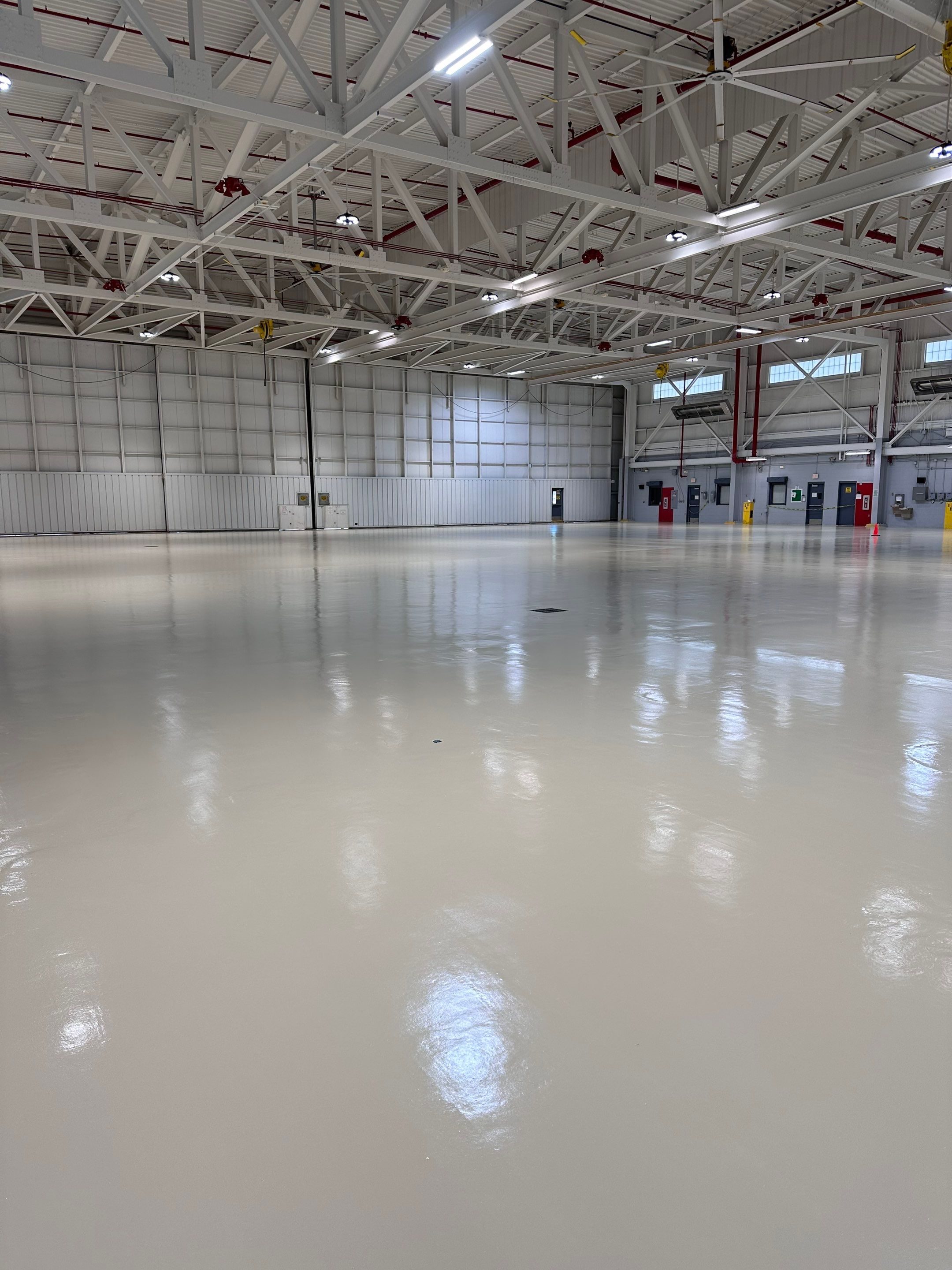 Industrial Epoxy Flooring for Army National Guard Hangar in Mobile by Cornerstone Hard Surface Restoration 
