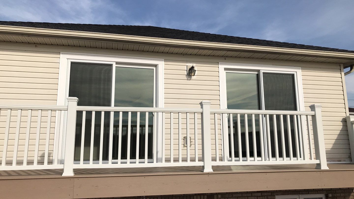Deck Refurbush and Door Replacement using Trex Decking and Railing. Polaris Patio Doors by Secure Construction Company Inc