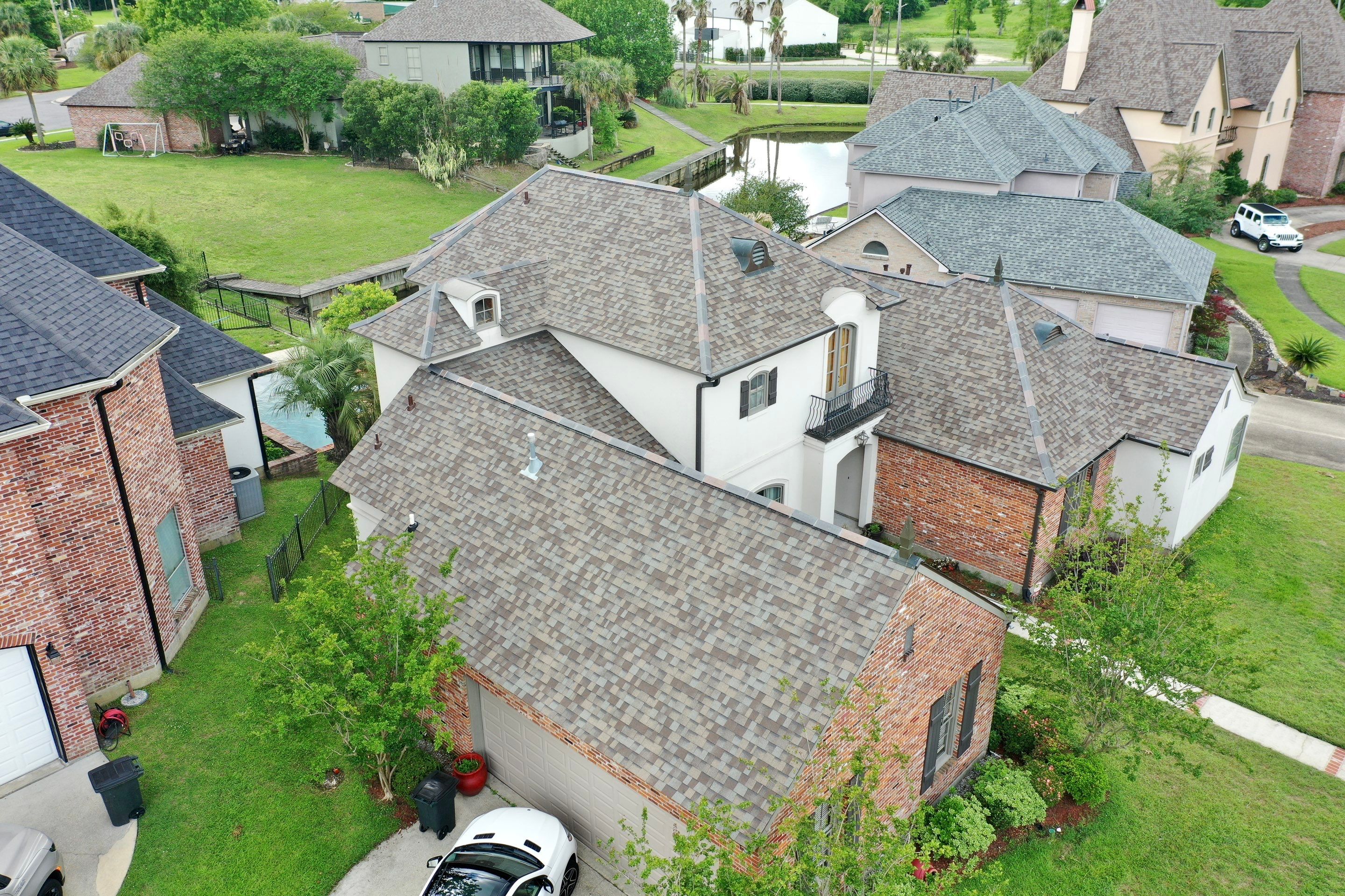 Owens Corning Duration Driftwood with Hecker Ridge Tile by Top Team Construction
