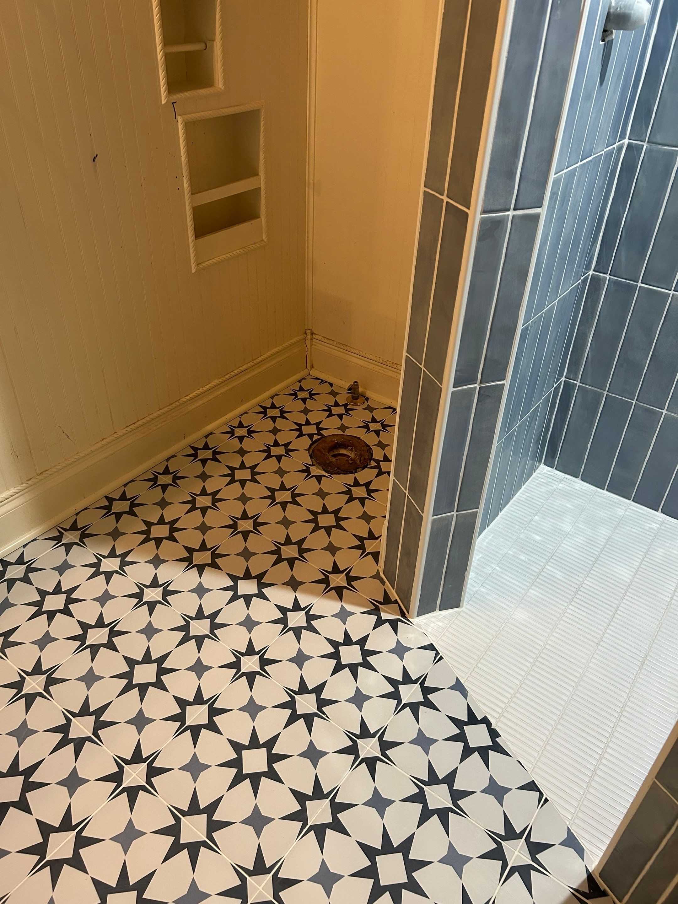 Tile shower and floor by Footprints Floors of Nashville