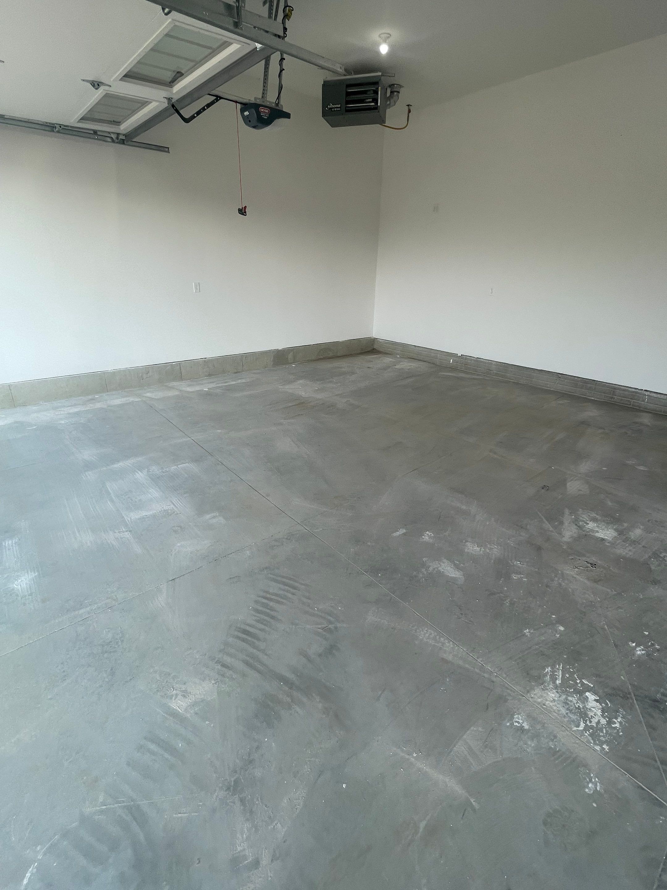 Grey Speckled Garage Floor Coating in Sioux Falls by Select Painting, Coatings & Garage Cabinets