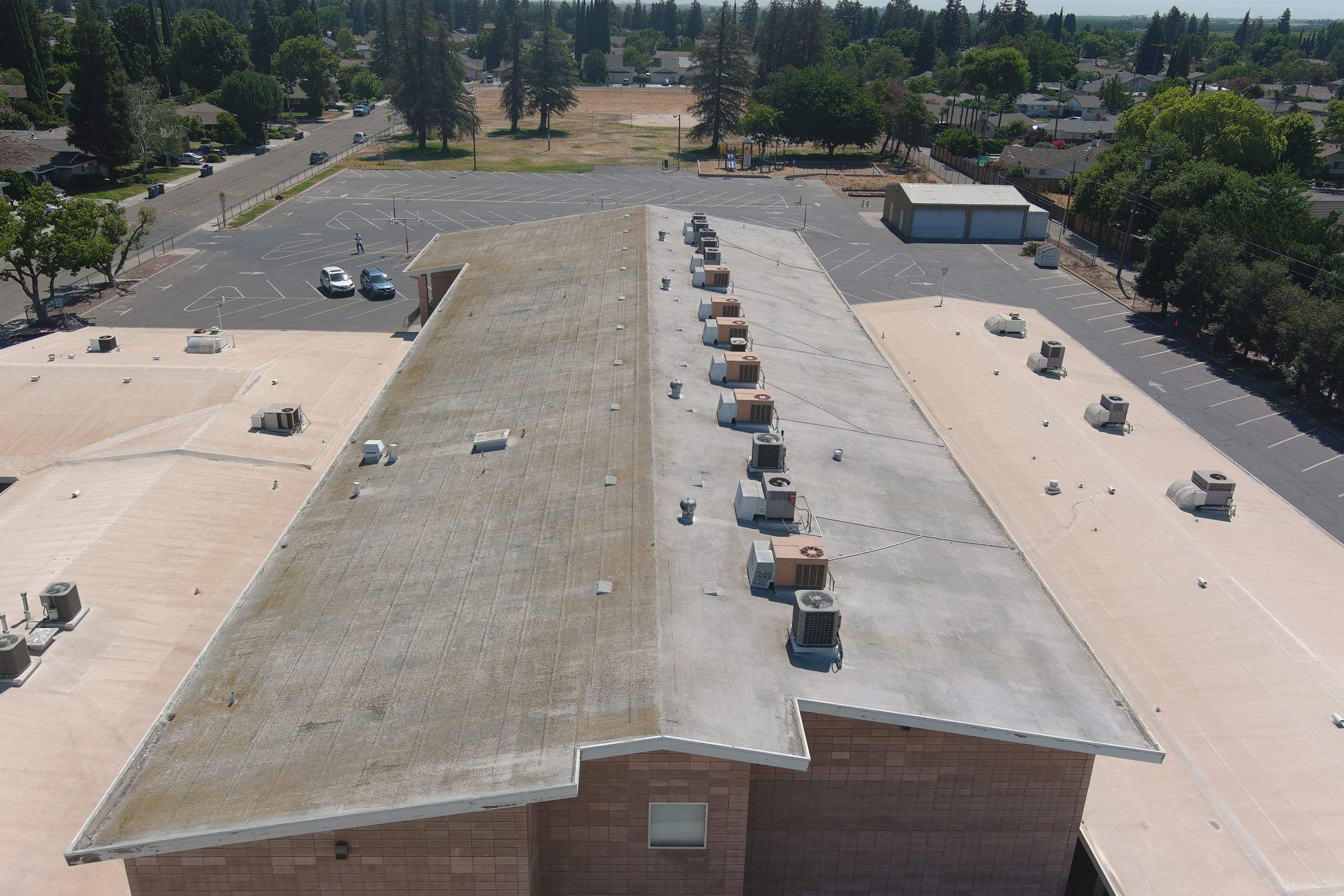 MR Roofing system using Benchmark/PUMA XL coatings over TPO single-ply roofing by Straight Edge Roofing Inc