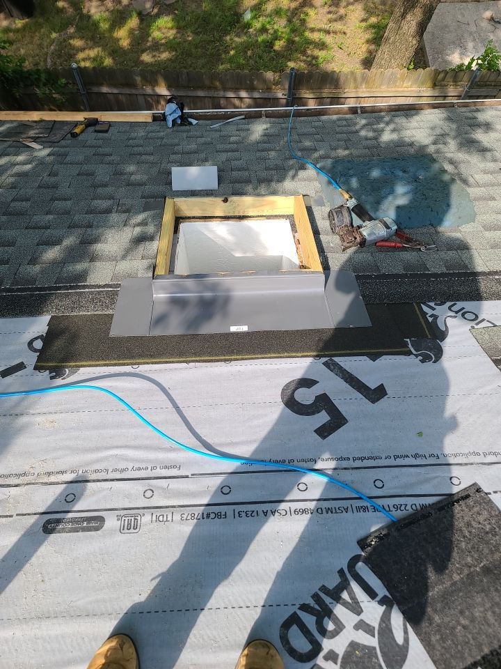Impact Resistant Roof Replacement and Skylight Project in Norman Oklahoma by McCann's Roofing and Construction