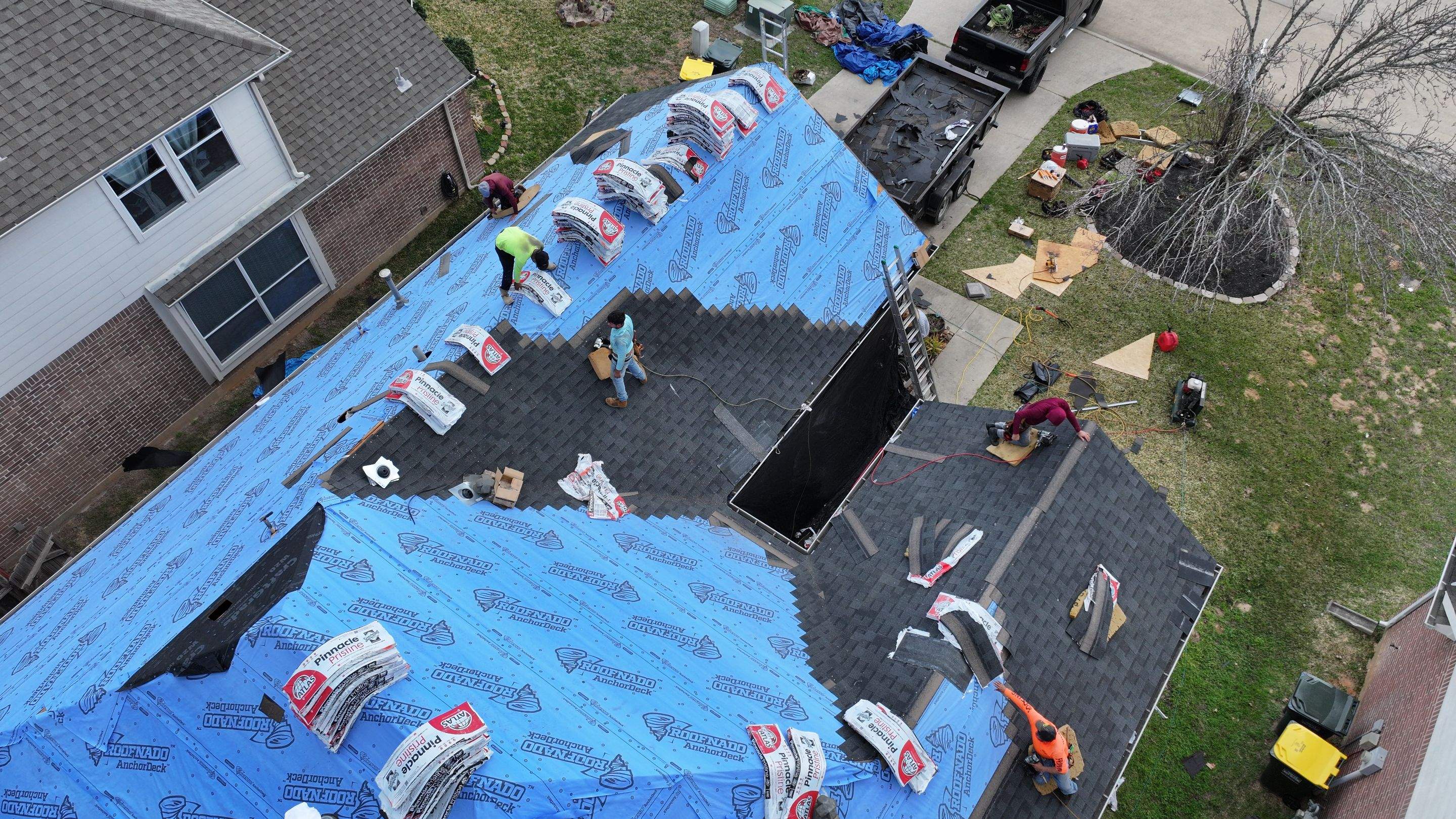 Full Roof Replacement on Brick Two-Story — Conroe, TX by PL Roofing & SB Roofing, LLC.