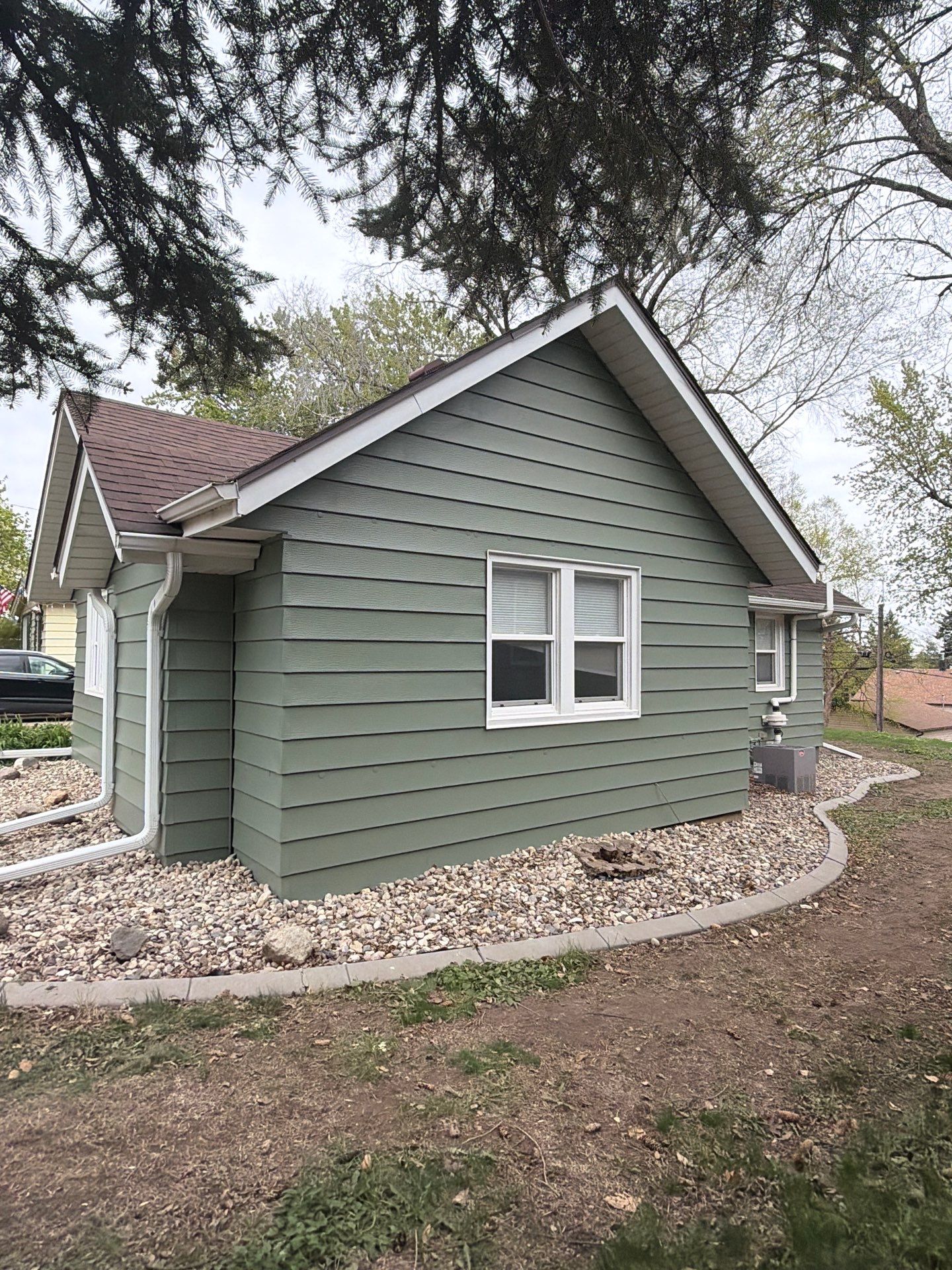 Exterior Siding Repair and Full House Repaint in Sioux Falls by Select Painting, Coatings & Garage Cabinets