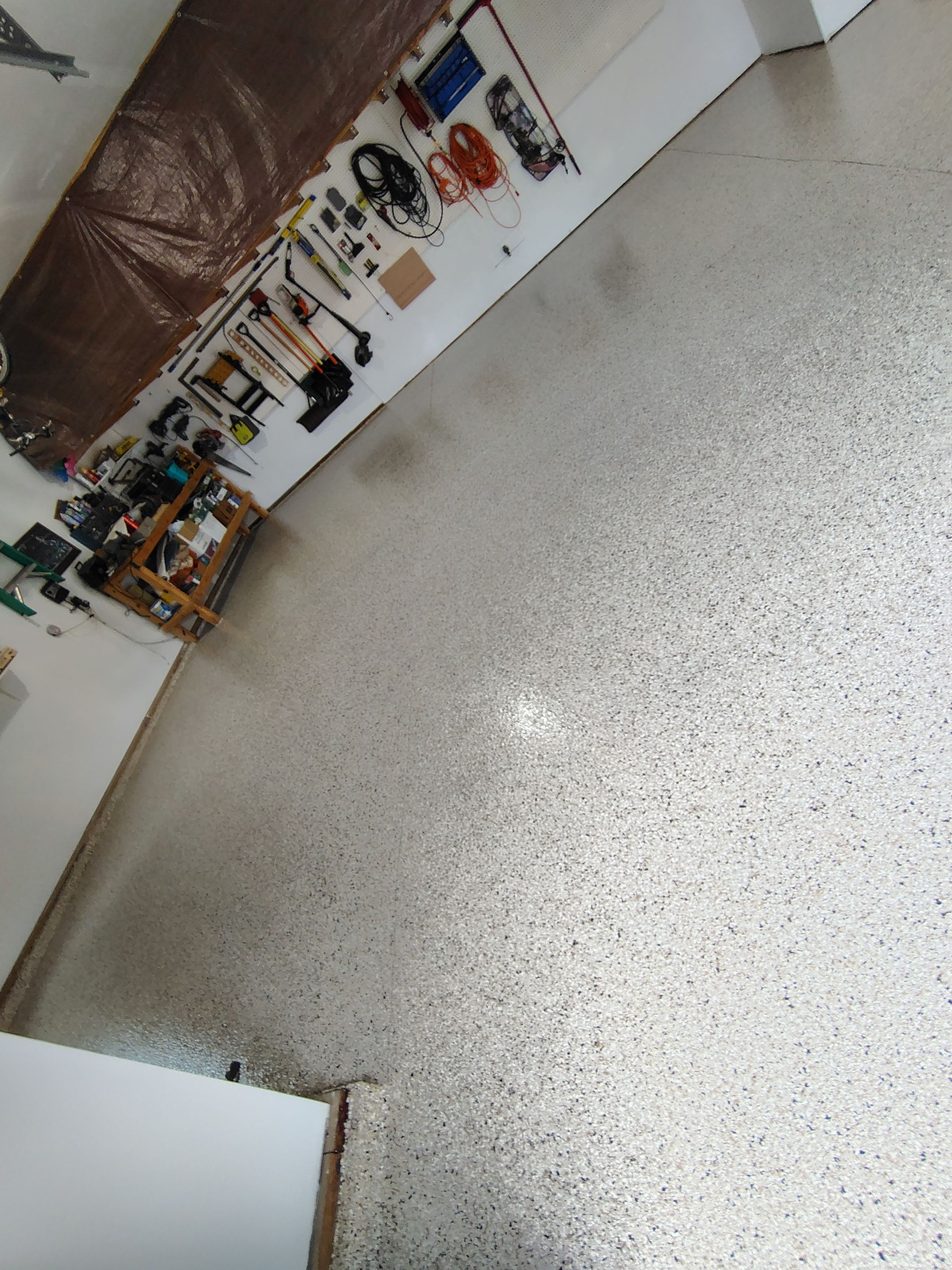 Durable Garage Floor Coating in Brandon by Select Painting, Coatings & Garage Cabinets