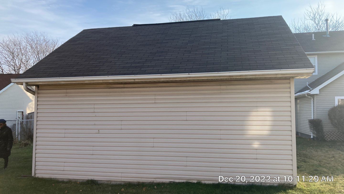 Wind damage to Siding: Insurance paid for full replacement of all siding by Absolute Roofing and Construction