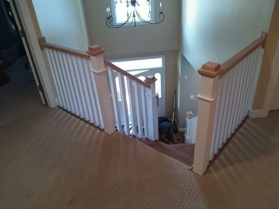 Stairway Installation using Red oak modern railings by House Custom Carpentry, LLC