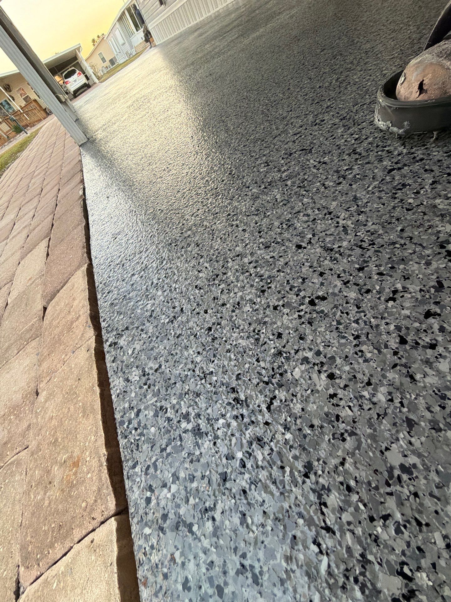 Driveway Transformation: Nightfall Flake System with Full UV & Moisture Protection by Performance Floors & Coating