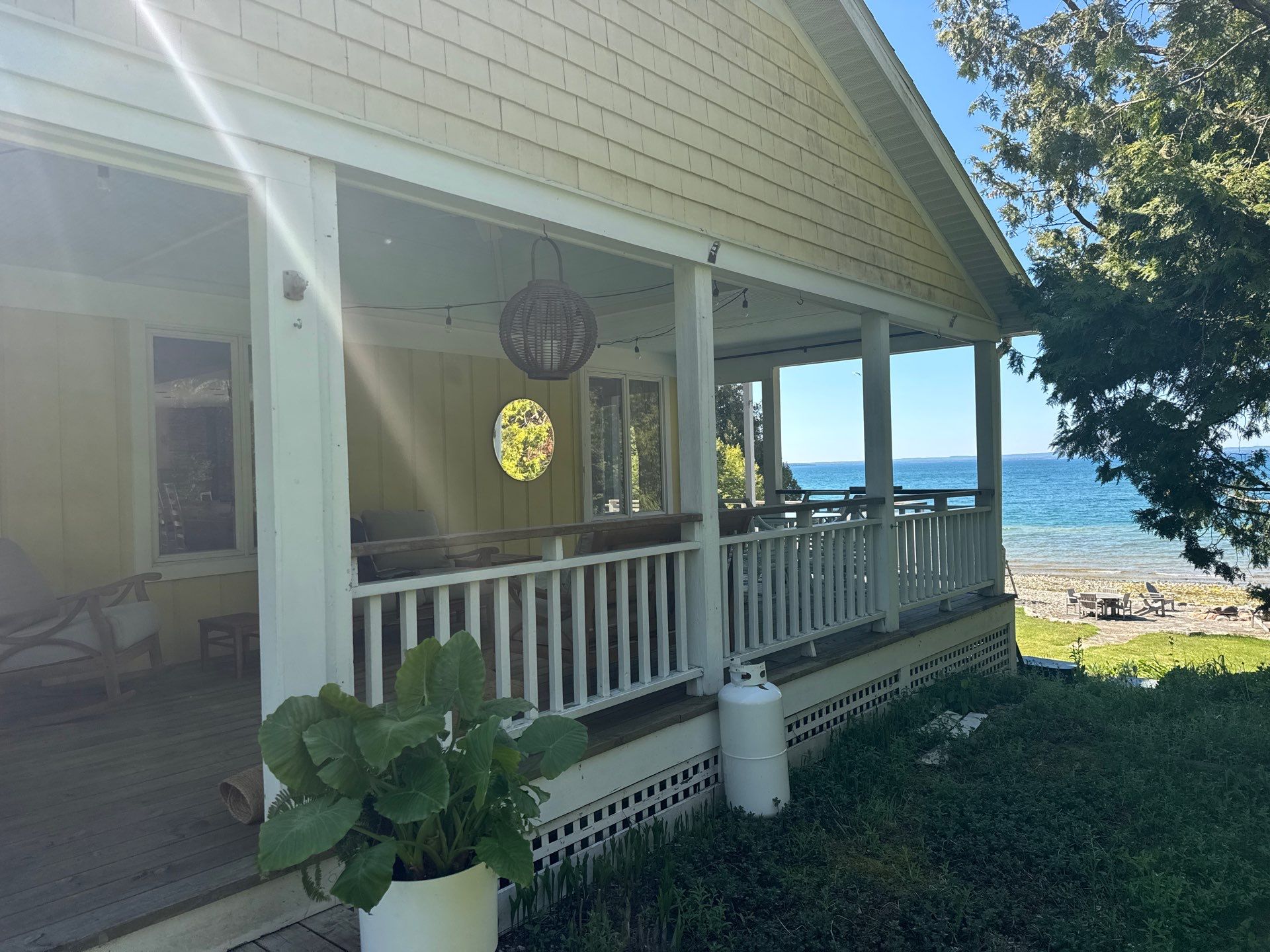 Sunesta motorized Sentry Privacy Screen Installation for Saint Ignace Waterfront Porch by Rainbow Seamless Systems