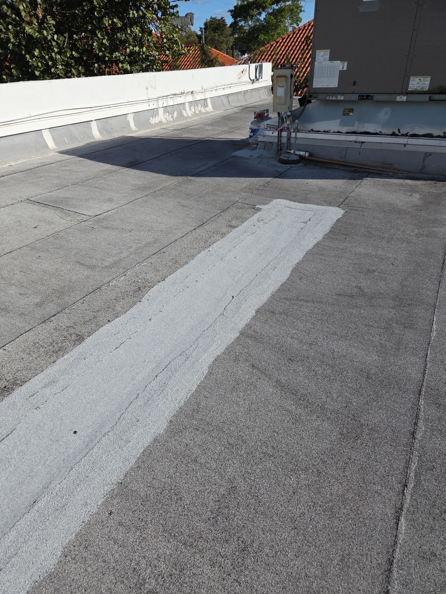 Commercial Flat Roof Restoration Using Silicone Coating in Hallandale Beach by Aastro Roofing