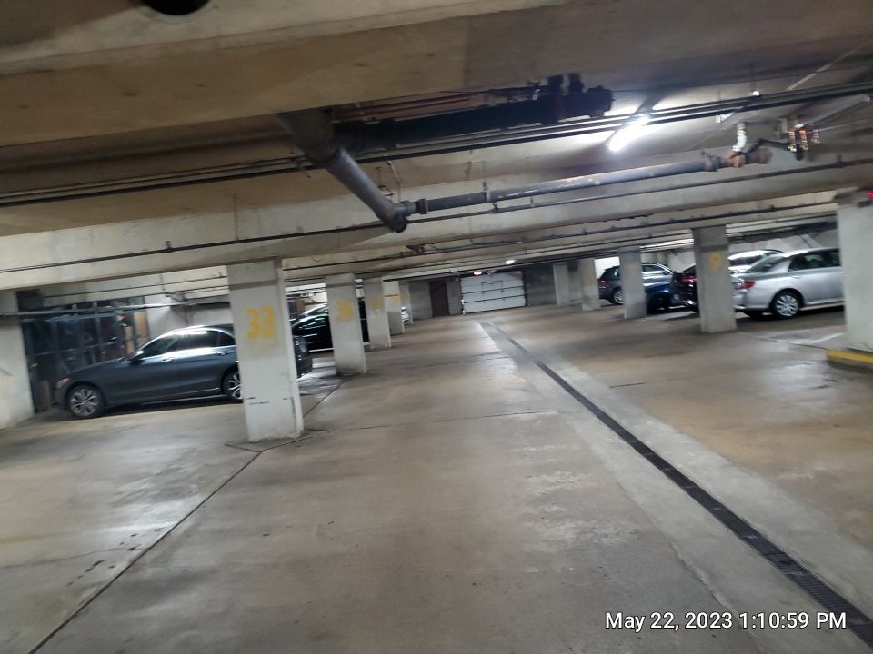 Parking garage using Hot water by Northern Power Washing LLC.